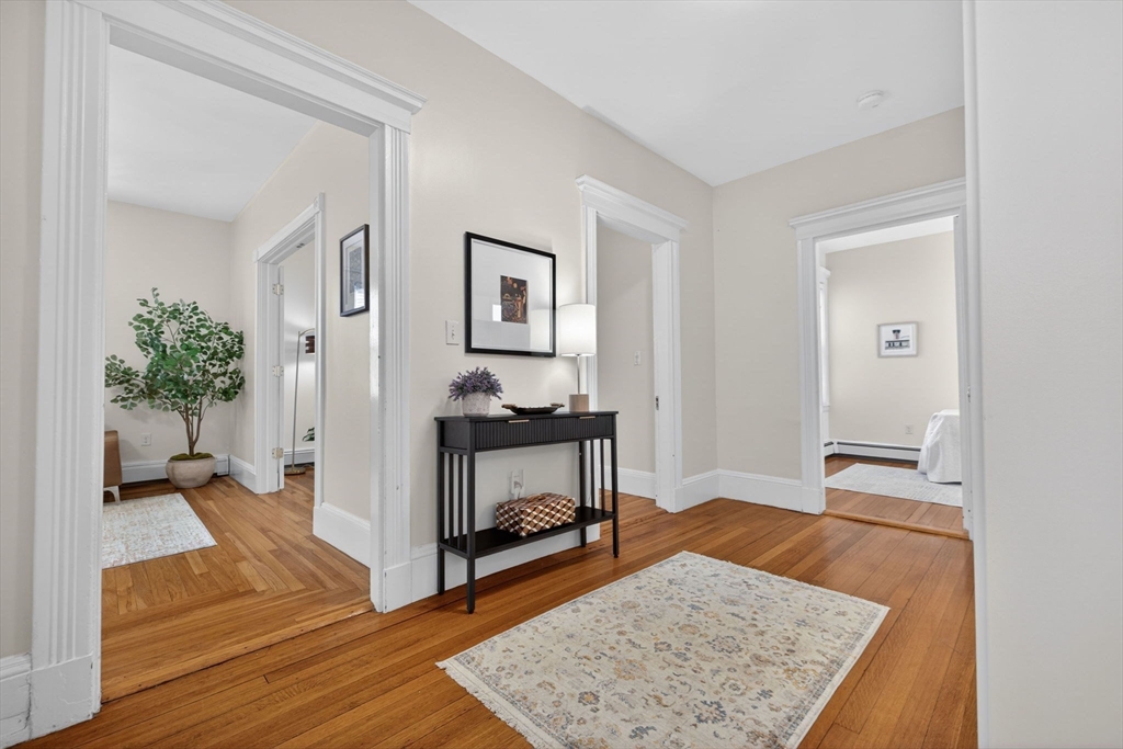 60 Iffley Road, Unit 2 Boston, MA 02130 - Photo 8 of 26 a living room with furniture and a wooden floor