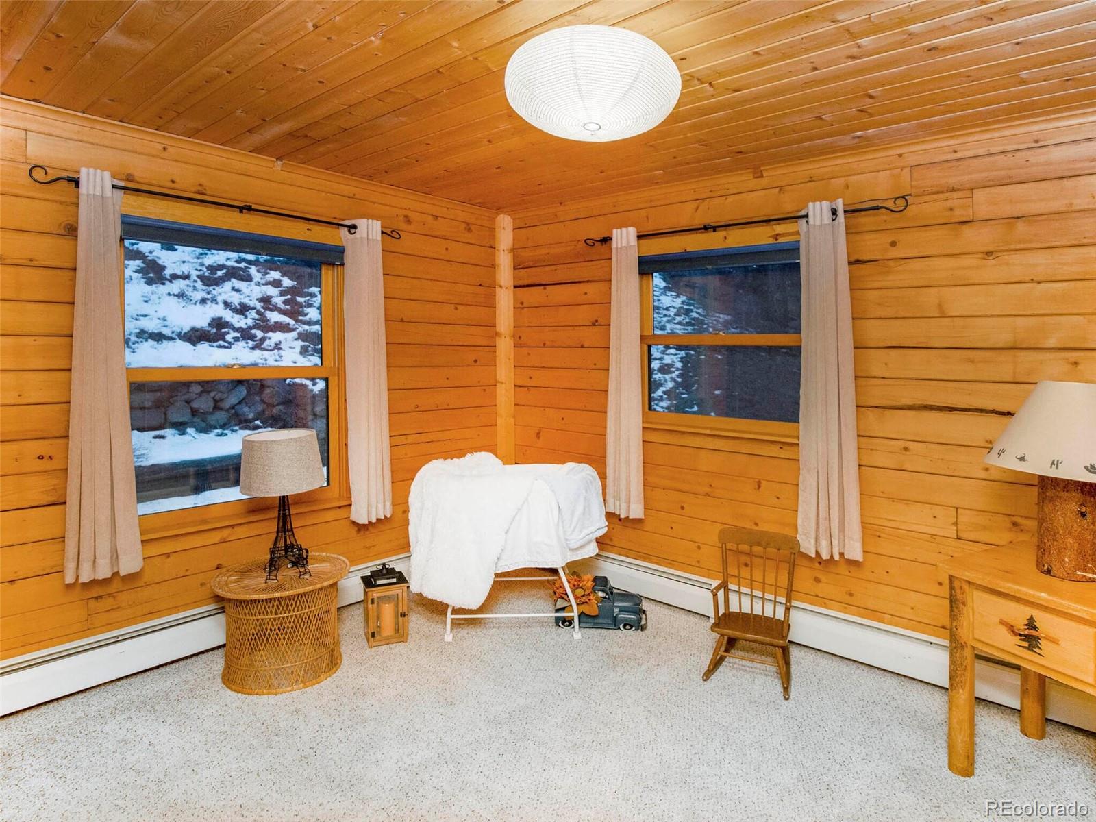 25633 Independence Trail Evergreen, CO 80439 - Photo 28 of 39 a room with furniture and a window