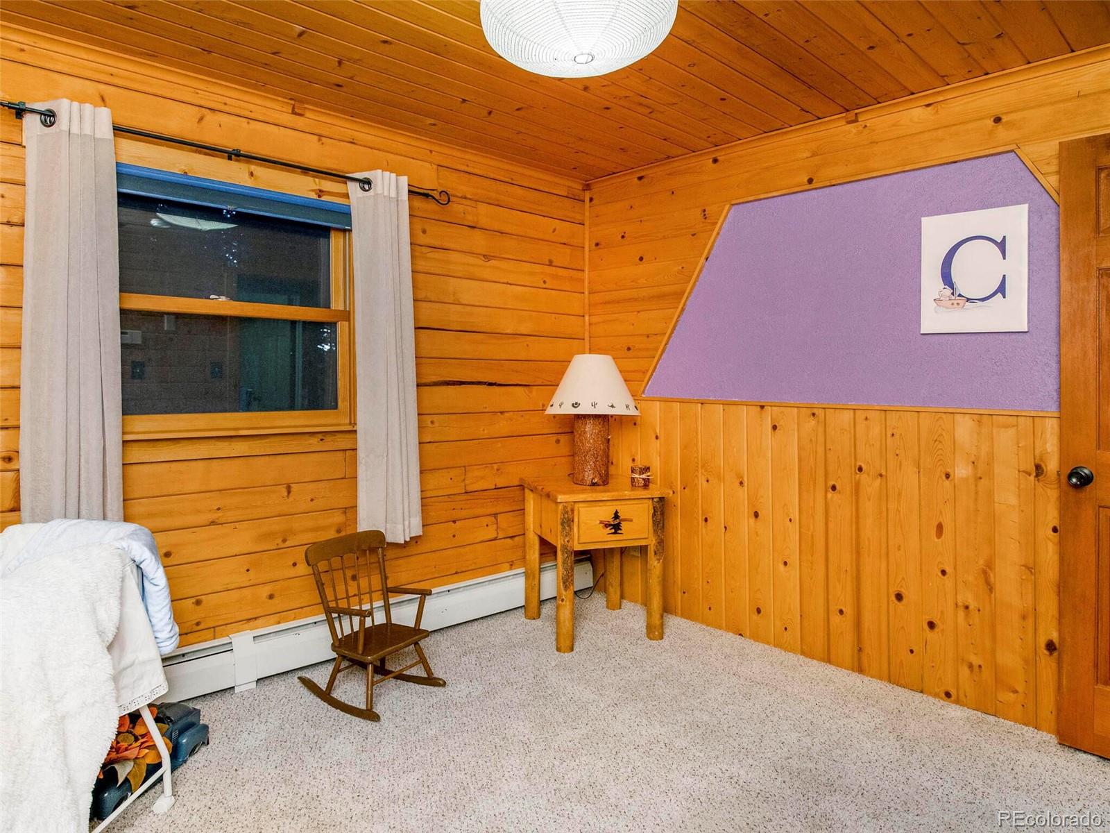 25633 Independence Trail Evergreen, CO 80439 - Photo 29 of 39 a backyard with table and chairs