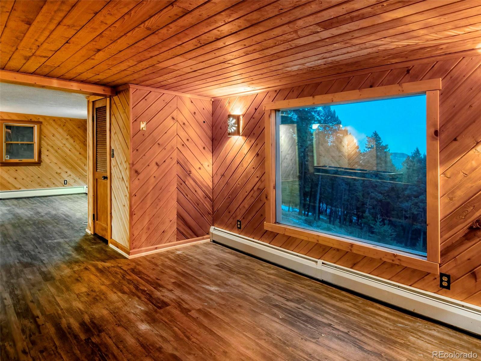 25633 Independence Trail Evergreen, CO 80439 - Photo 30 of 39 a view of a room with wooden floor