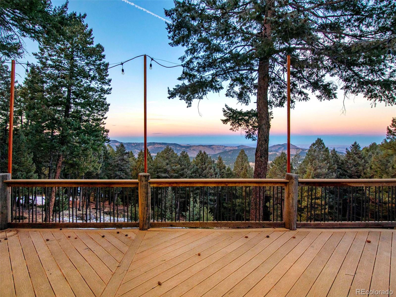 25633 Independence Trail Evergreen, CO 80439 - Photo 35 of 39 a view of balcony with wooden floor and fence