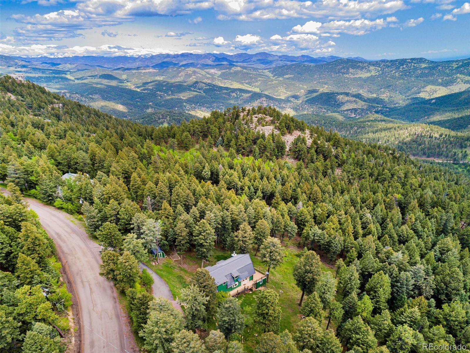 25633 Independence Trail Evergreen, CO 80439 - Photo 37 of 39 a view of a city with mountains in the background