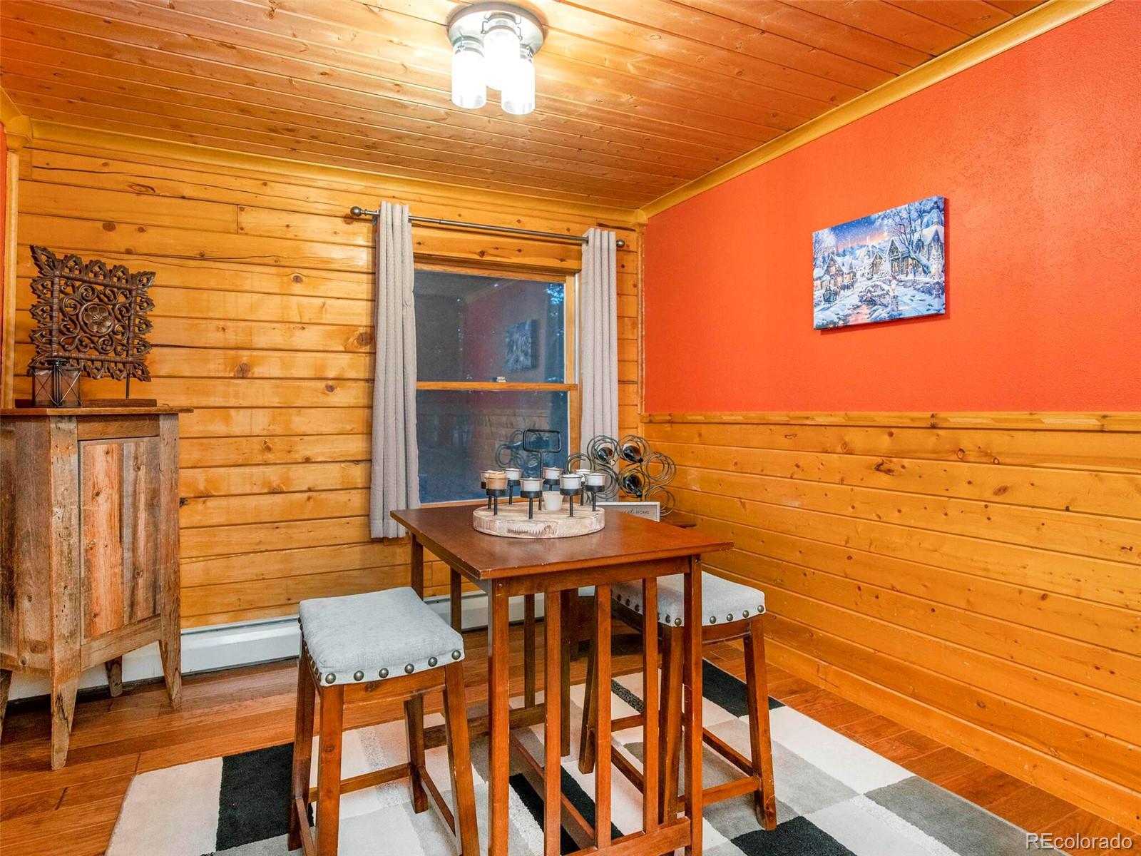 25633 Independence Trail Evergreen, CO 80439 - Photo 8 of 39 a view of a chairs and table in a patio