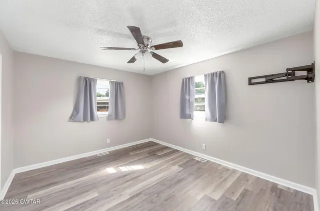 a view of empty room with windows