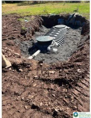 a view of a backyard with swimming pool