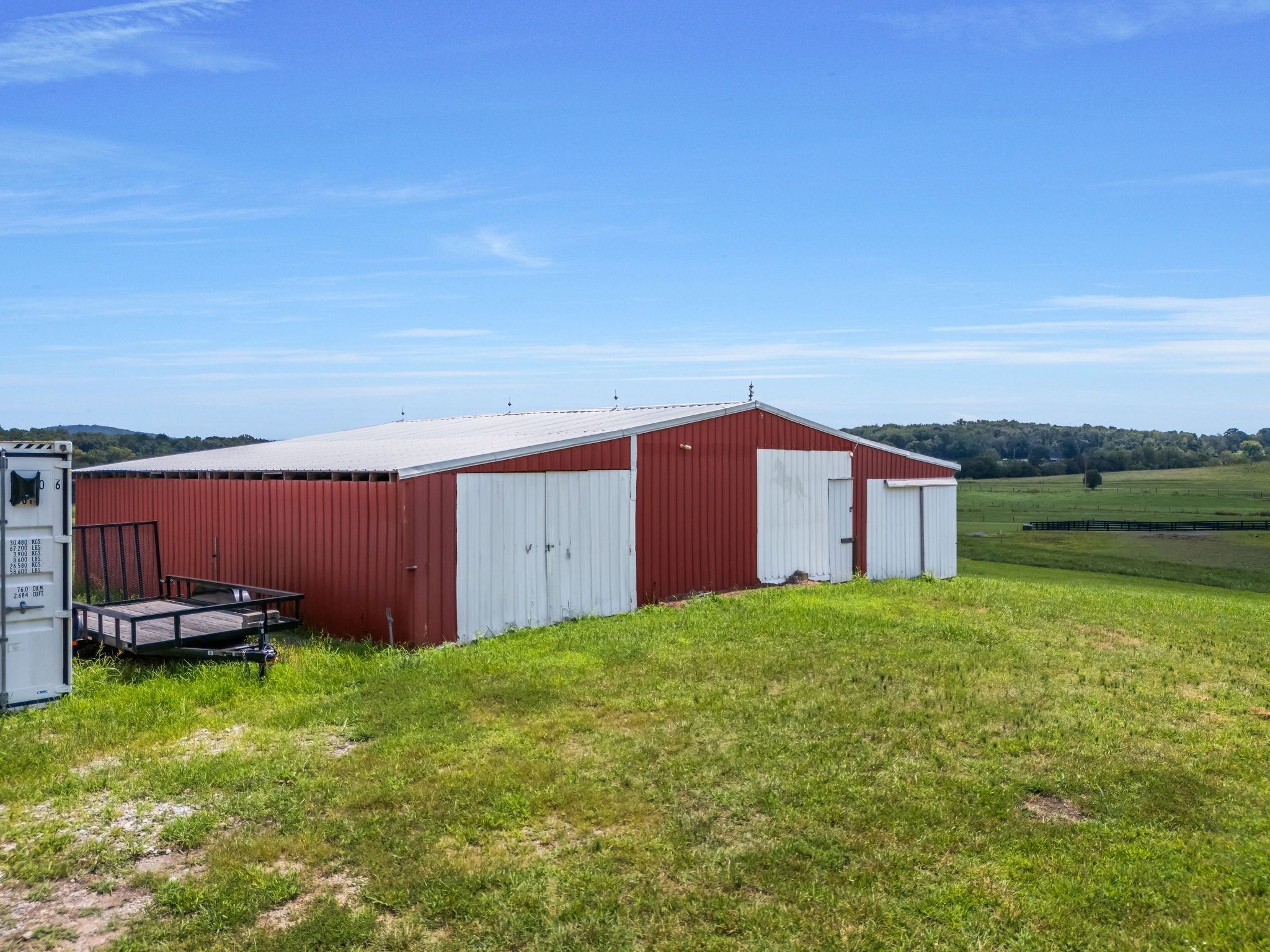 1295 Sugar Flat Road Lebanon, TN 37087 - Photo 11 of 30 a view of a backyard with lawn chairs plants and large tree