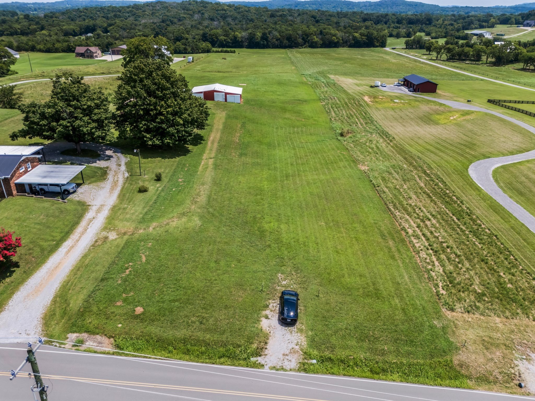 1295 Sugar Flat Road Lebanon, TN 37087 - Photo 2 of 30 a view of a swimming pool and a yard