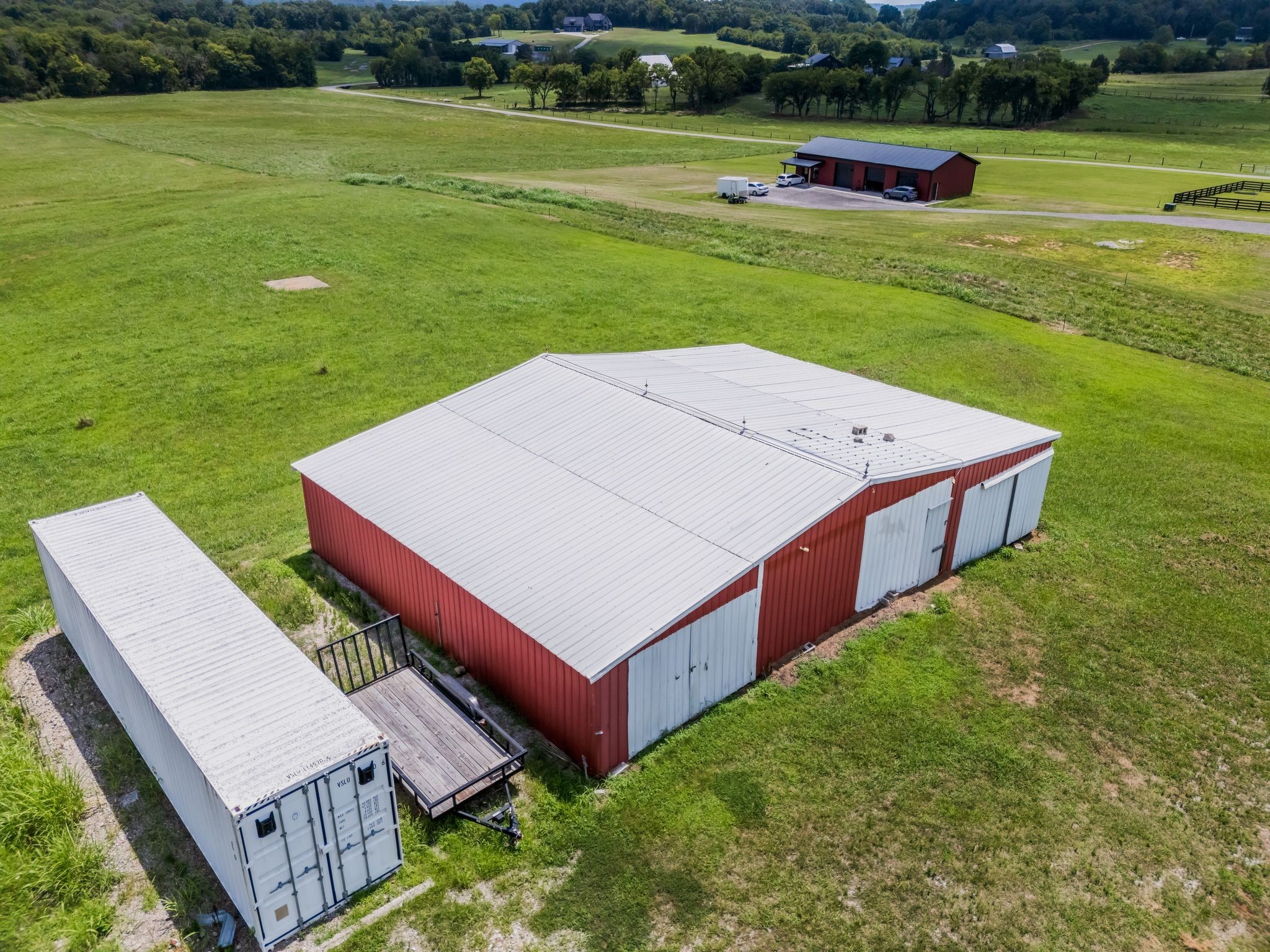 1295 Sugar Flat Road Lebanon, TN 37087 - Photo 10 of 30 a backyard of a house with lots of green space and plants