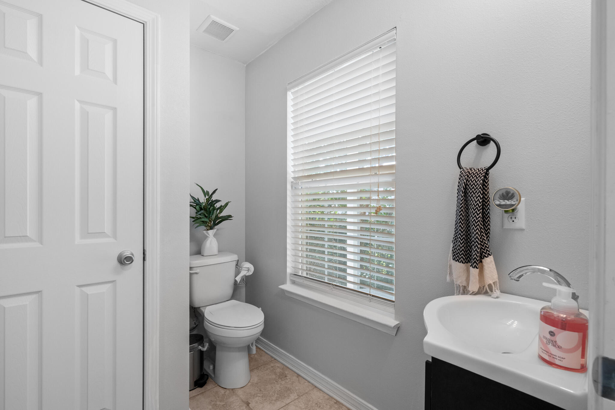 104 Lear Court Crestview, FL 32539 - Photo 13 of 27 a bathroom with a toilet sink and a window