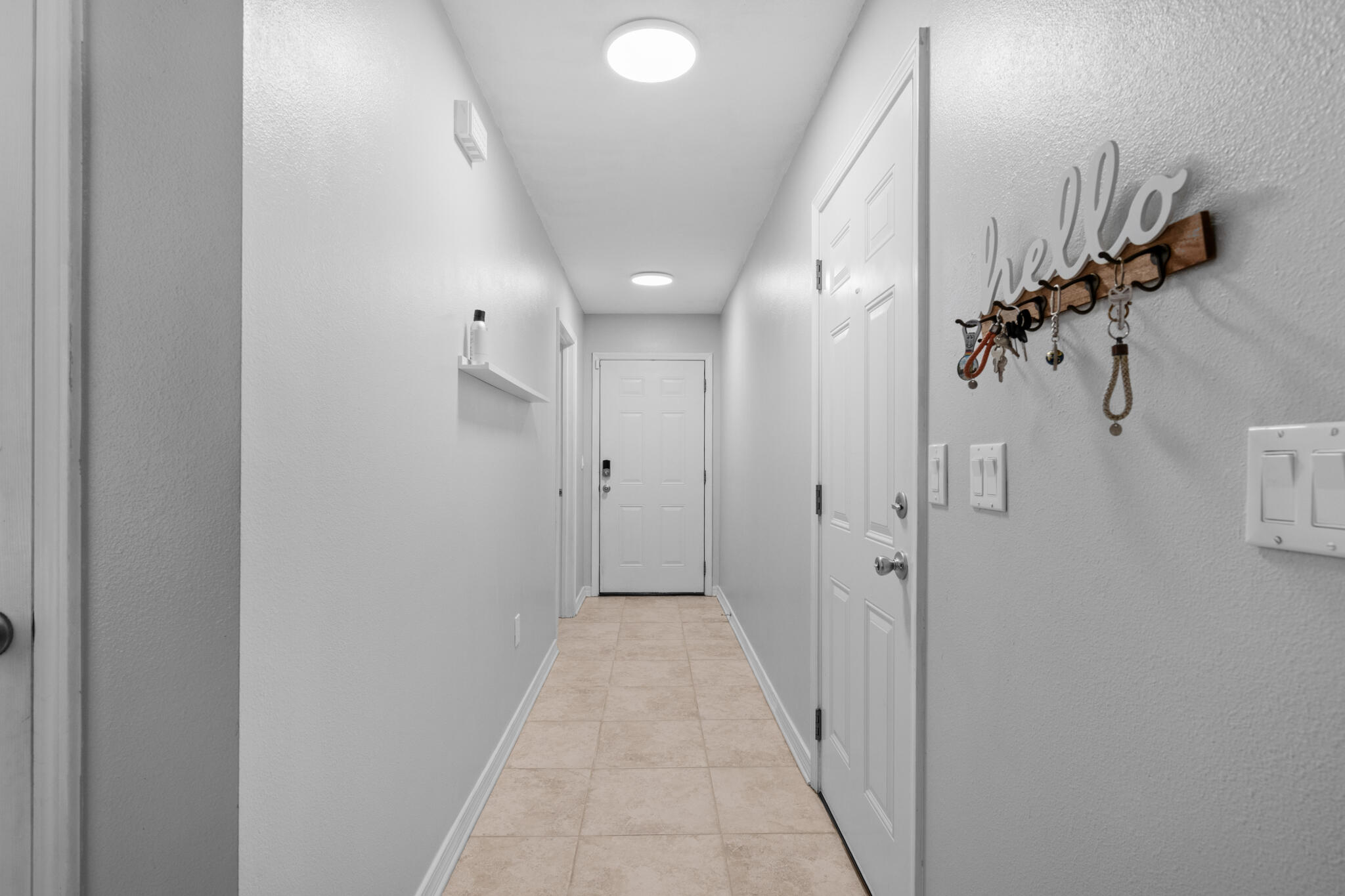 104 Lear Court Crestview, FL 32539 - Photo 14 of 27 a view of a hallway with a chandelier