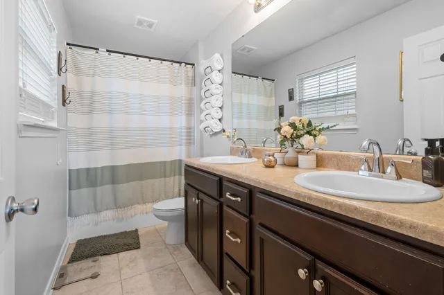 a picture of a room with a cabinet and white walls