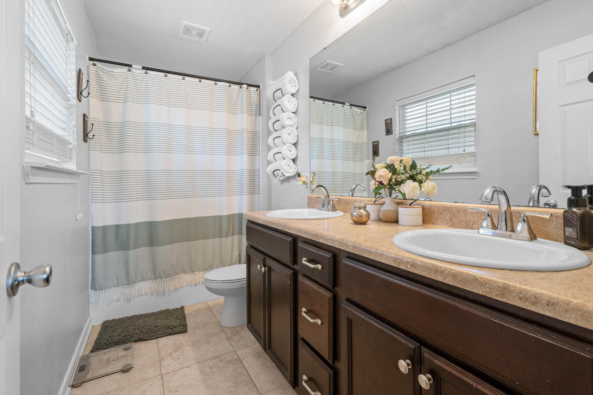 104 Lear Court Crestview, FL 32539 - Photo 22 of 27 a bathroom with a double vanity sink toilet and shower