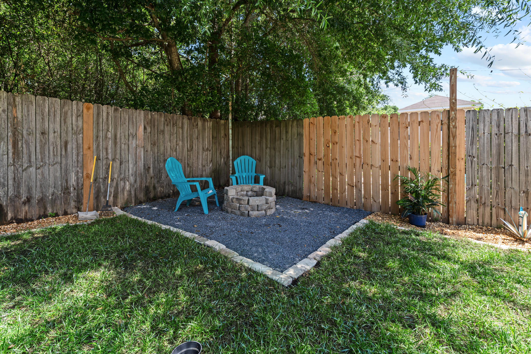 104 Lear Court Crestview, FL 32539 - Photo 26 of 27 a backyard of a house with table and chairs