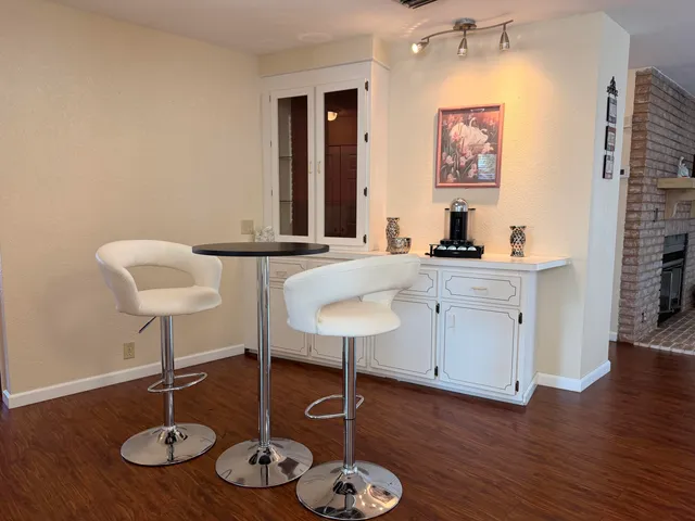a utility room with a sink and a mirror