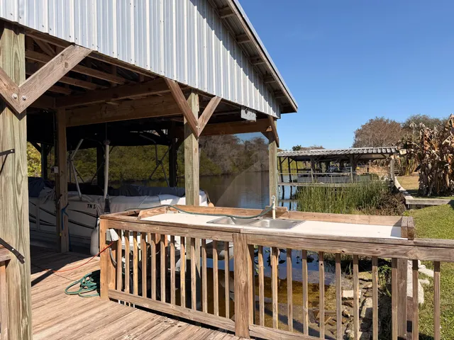 a view of a two chairs and table in the balcony