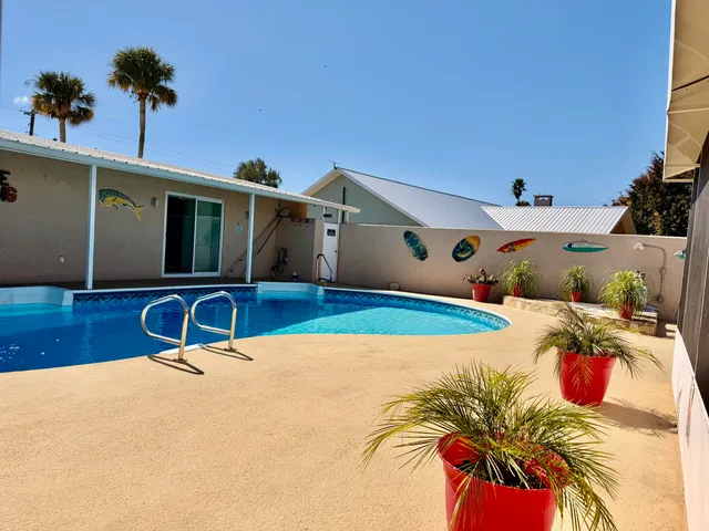 a kitchen with stainless steel appliances granite countertop a stove top oven a sink and dishwasher