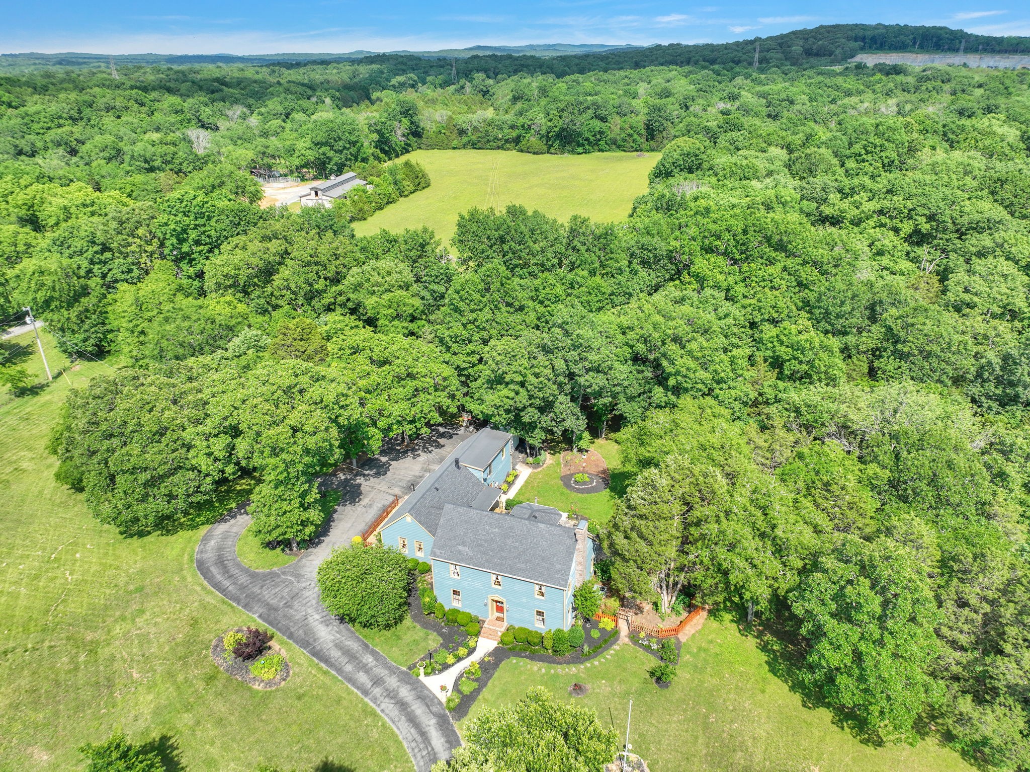 7797 Murfreesboro Road Lebanon, TN 37090 - Photo 15 of 57 a view of a lake with a house