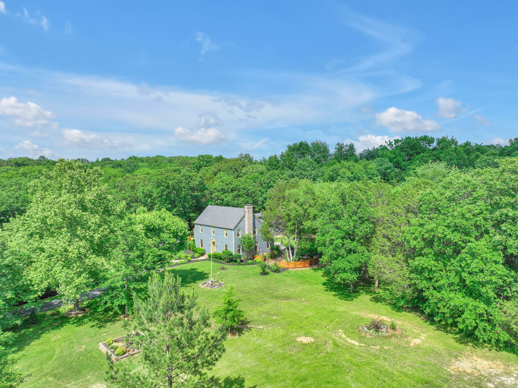 7797 Murfreesboro Road Lebanon, TN 37090 - Photo 16 of 57 a view of a house with a yard
