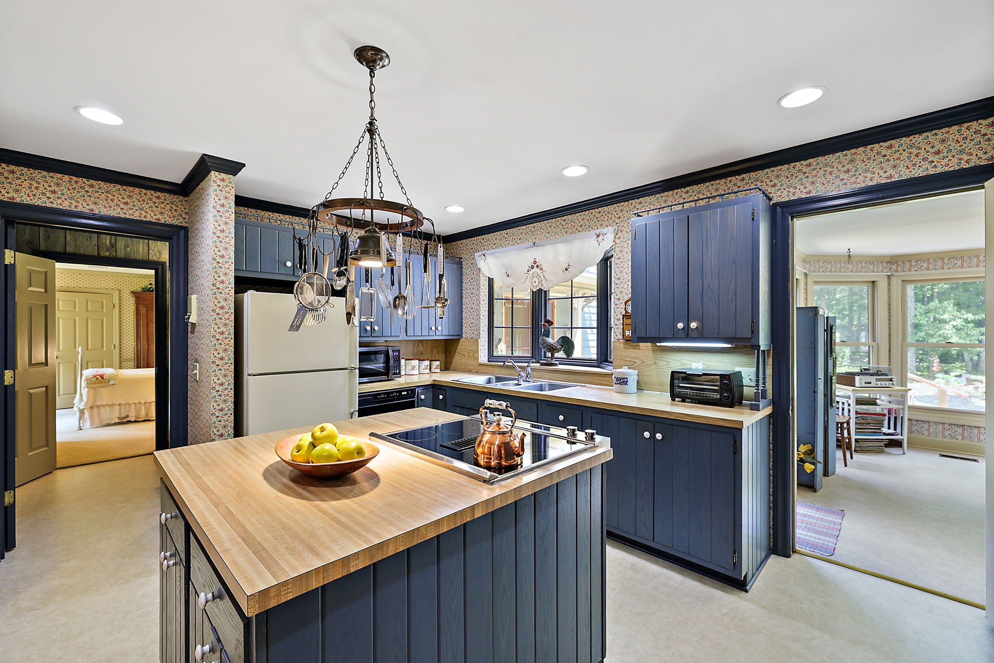 7797 Murfreesboro Road Lebanon, TN 37090 - Photo 26 of 57 a kitchen with a sink a stove and cabinets