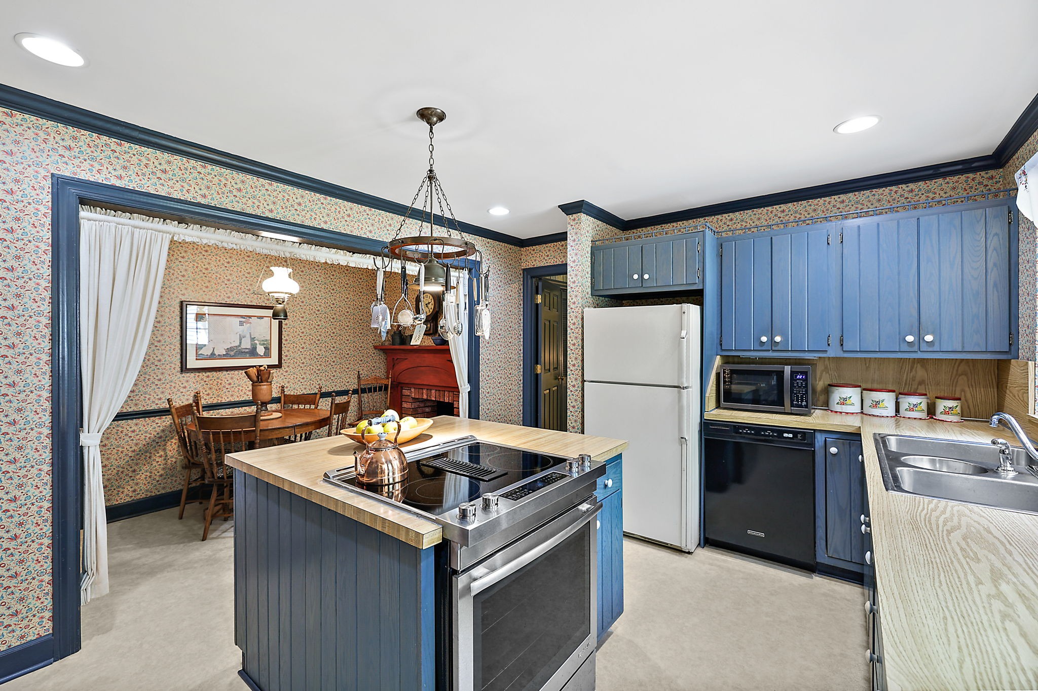7797 Murfreesboro Road Lebanon, TN 37090 - Photo 28 of 57 a kitchen that has a sink stainless steel appliances a counter top space and cabinets