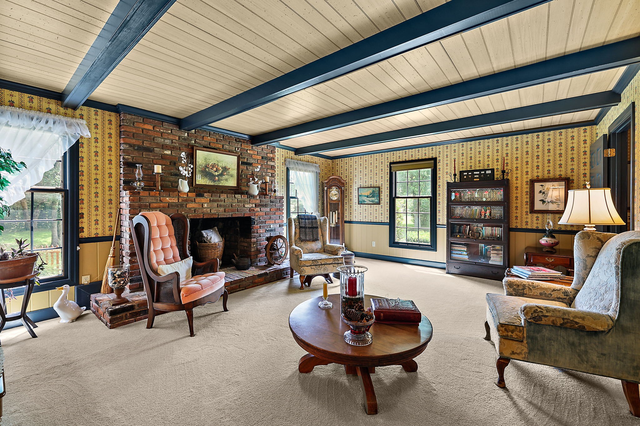 7797 Murfreesboro Road Lebanon, TN 37090 - Photo 34 of 57 a living room with furniture a fireplace and a large window