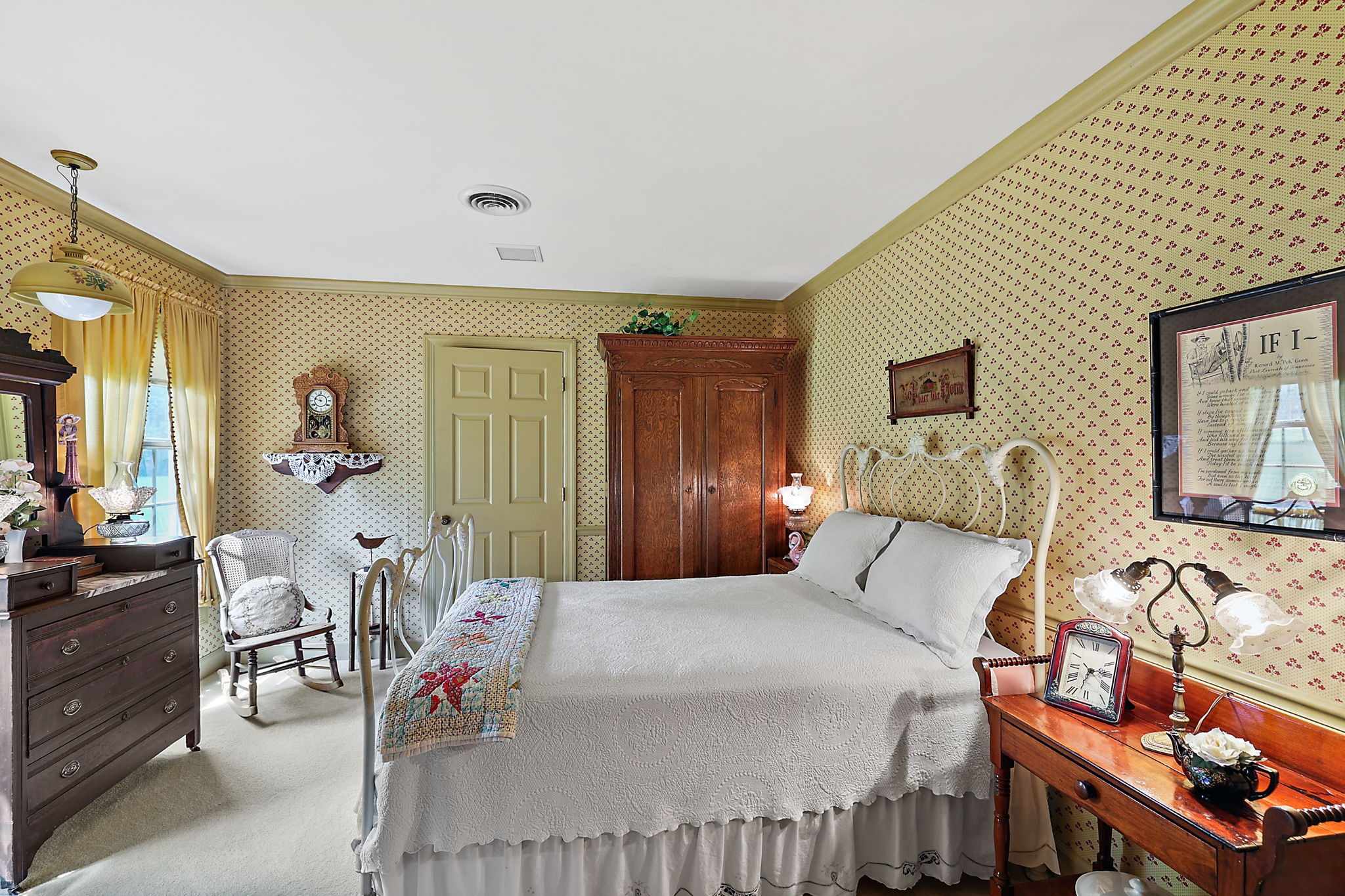 7797 Murfreesboro Road Lebanon, TN 37090 - Photo 44 of 57 a bedroom with a bed and dresser with mirror