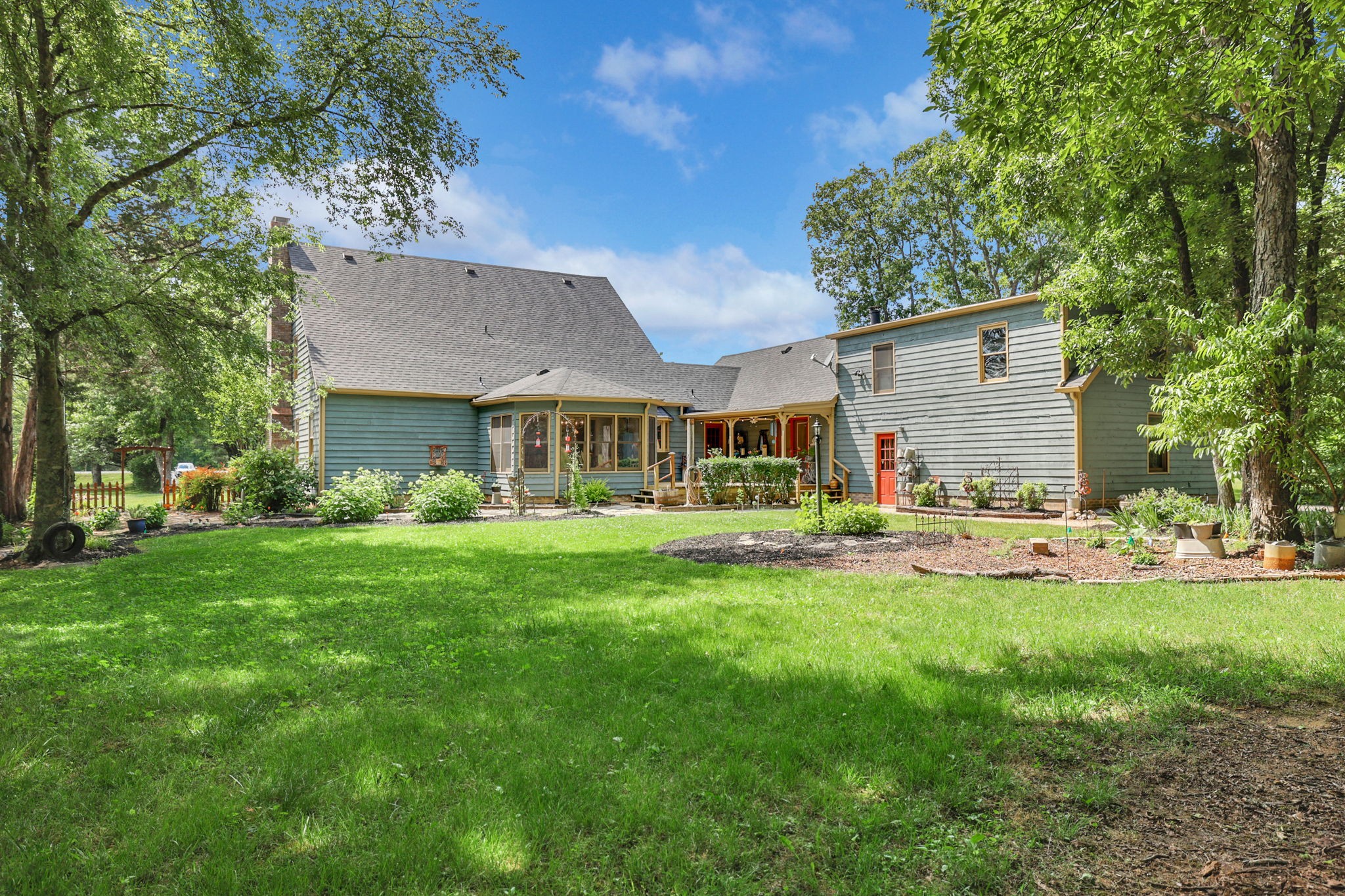 7797 Murfreesboro Road Lebanon, TN 37090 - Photo 48 of 57 a front view of a house with a garden and swimming pool