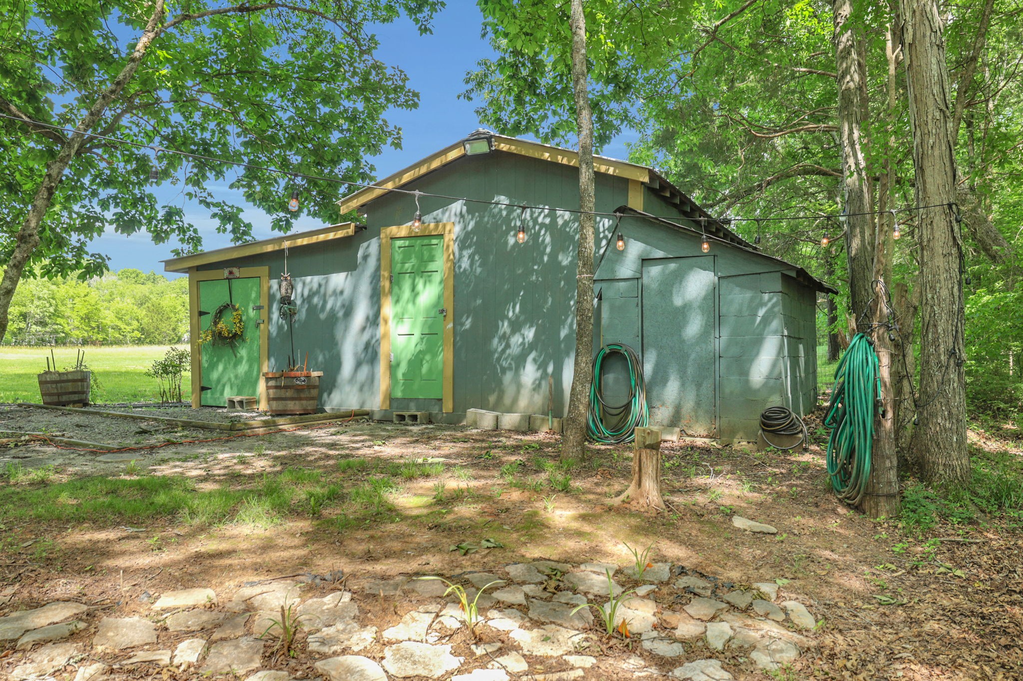 7797 Murfreesboro Road Lebanon, TN 37090 - Photo 50 of 57 a backyard of a house with lots of green space