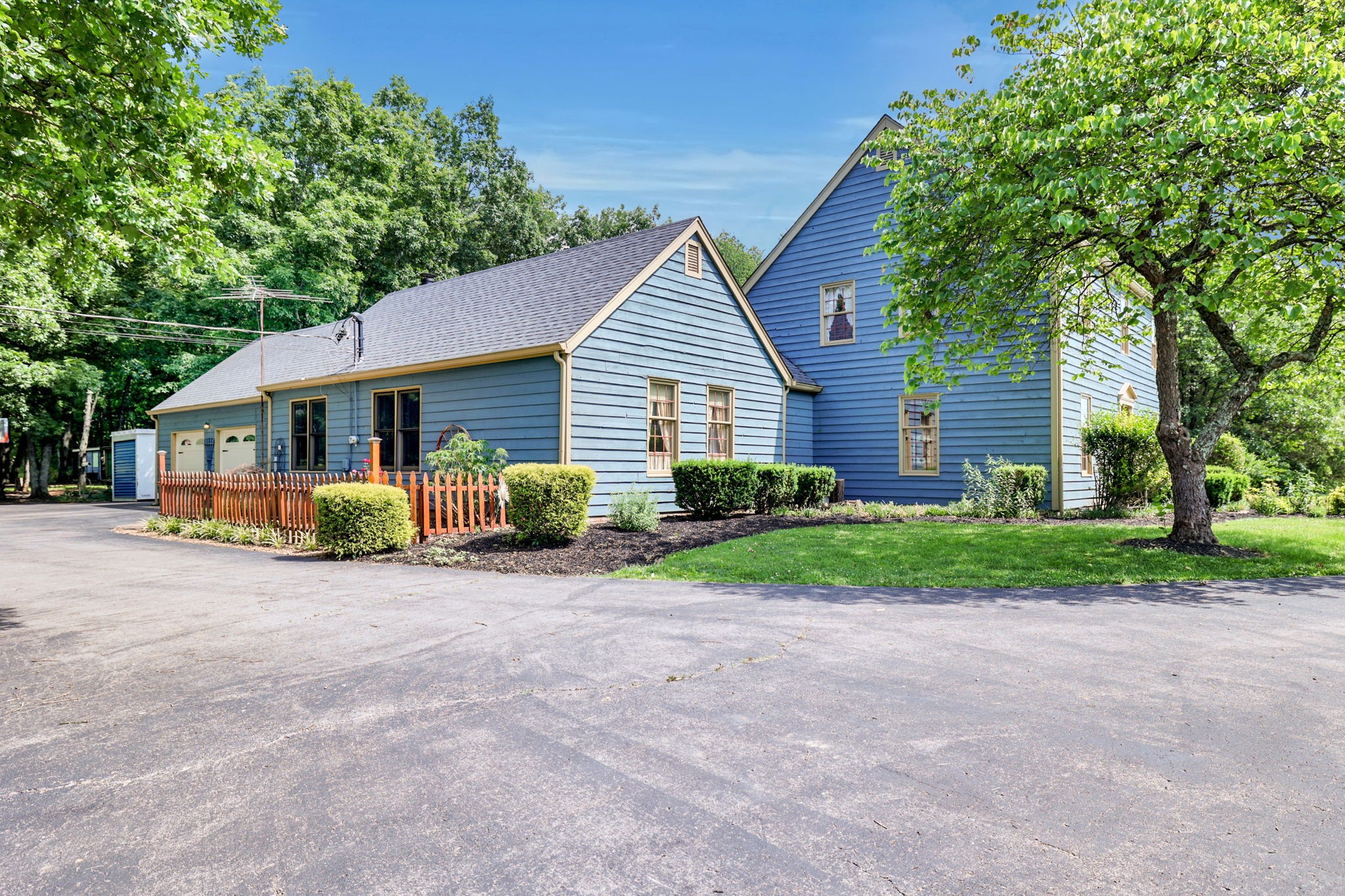 7797 Murfreesboro Road Lebanon, TN 37090 - Photo 5 of 57 a view of a house with a yard and large trees