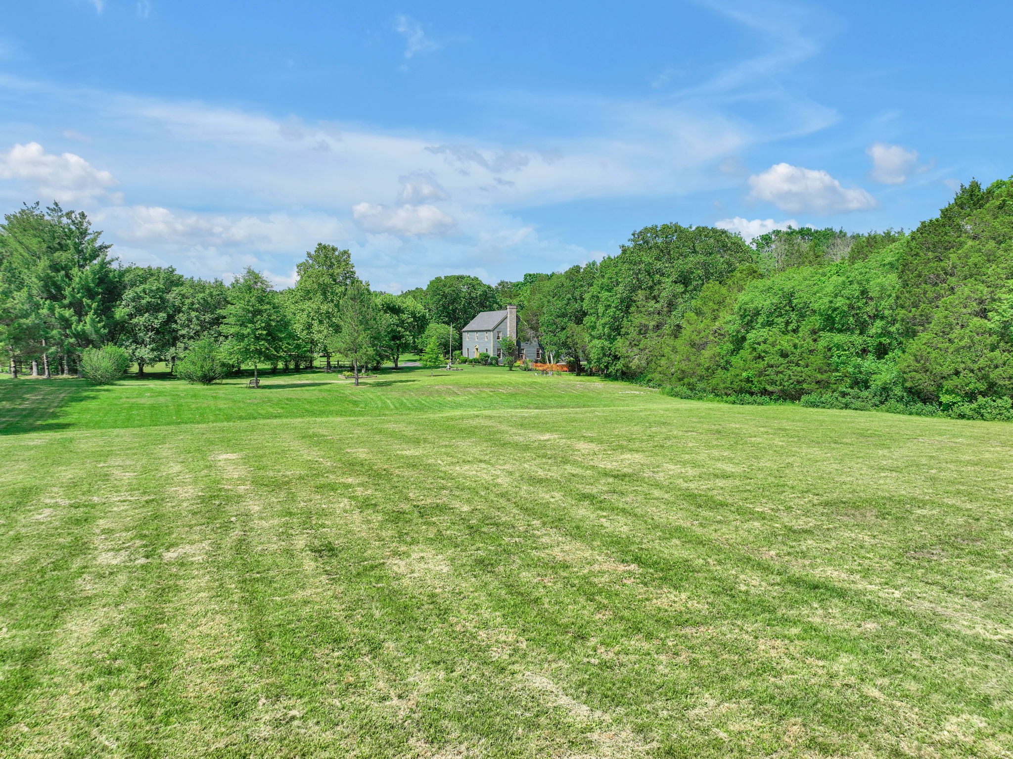 7797 Murfreesboro Road Lebanon, TN 37090 - Photo 54 of 57 a backyard of a house with lots of green space