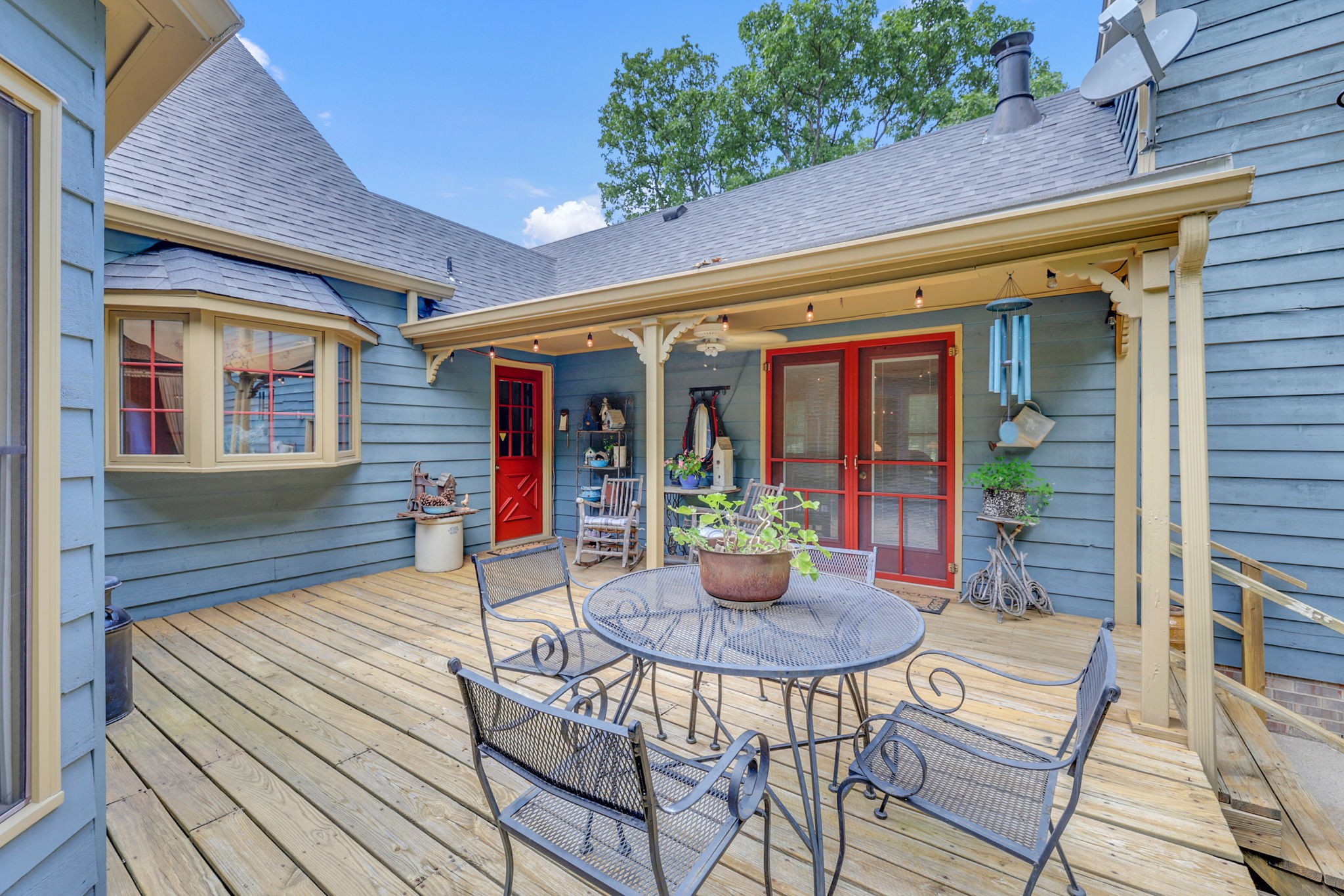 7797 Murfreesboro Road Lebanon, TN 37090 - Photo 7 of 57 a view of a patio with a table and chairs and potted plants