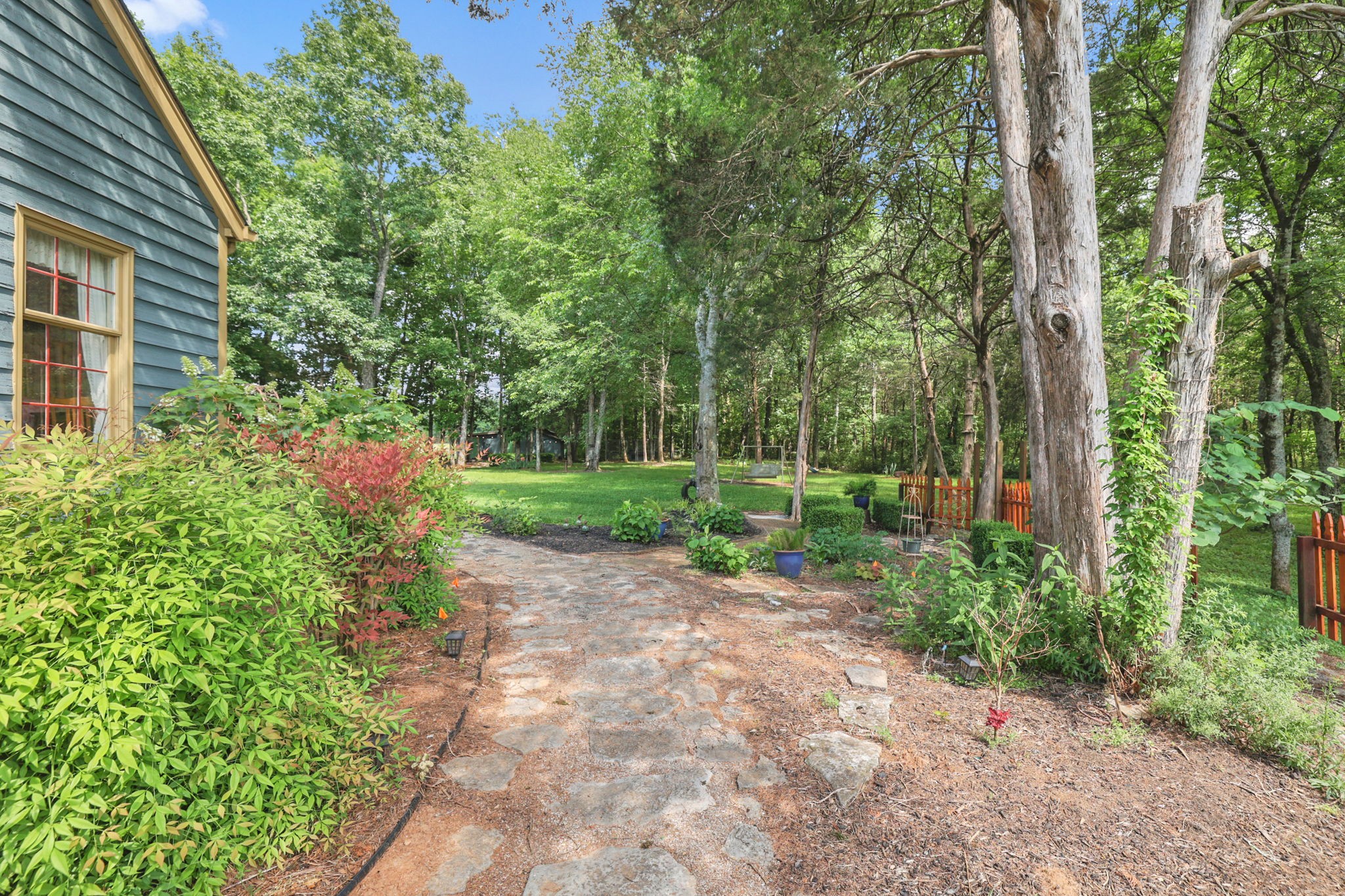 7797 Murfreesboro Road Lebanon, TN 37090 - Photo 9 of 57 a view of a backyard with plants