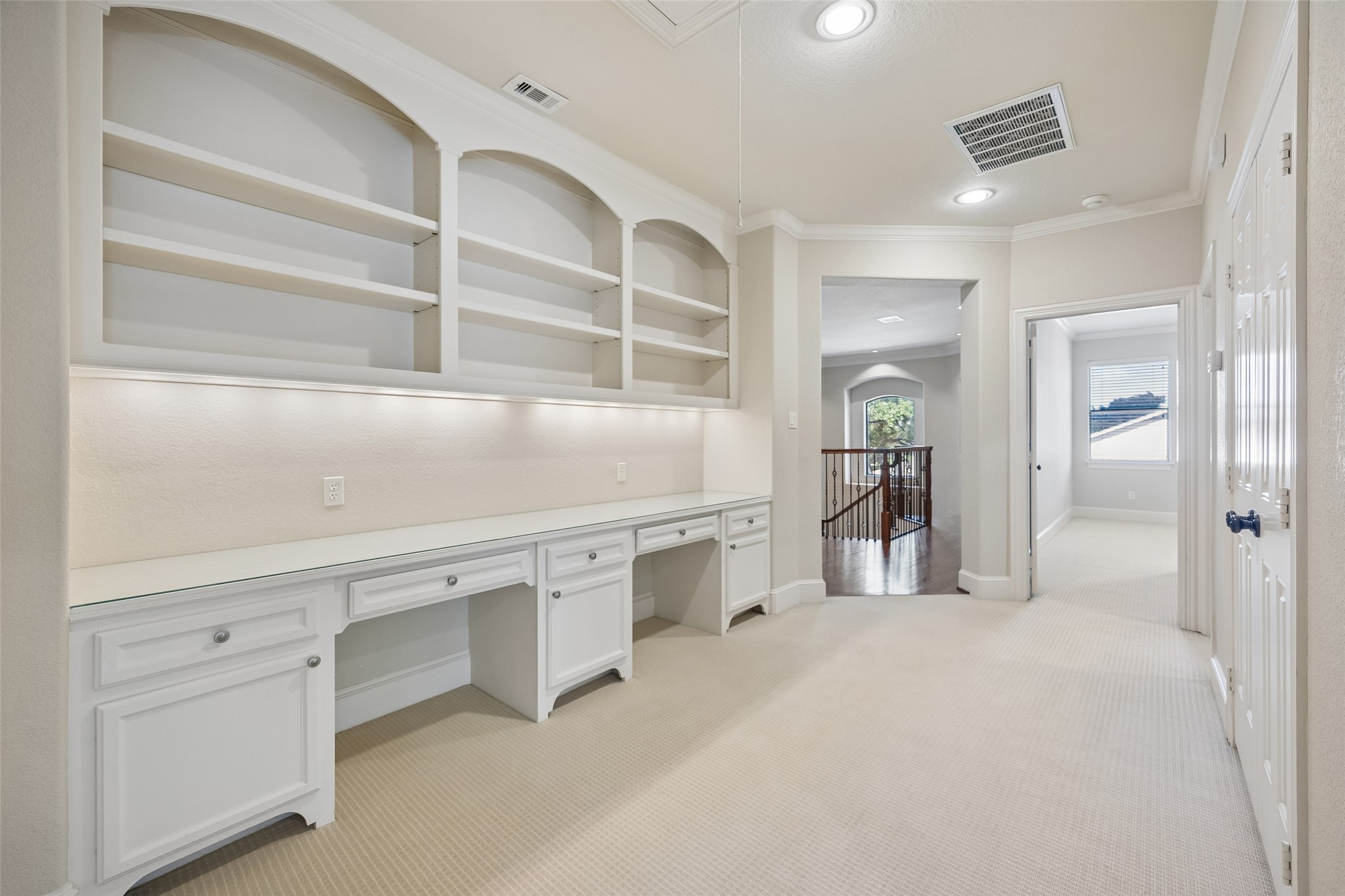 6261 Burgoyne Road Houston, TX 77057 - Photo 28 of 40 Second floor landing with built-in desk and shelving.