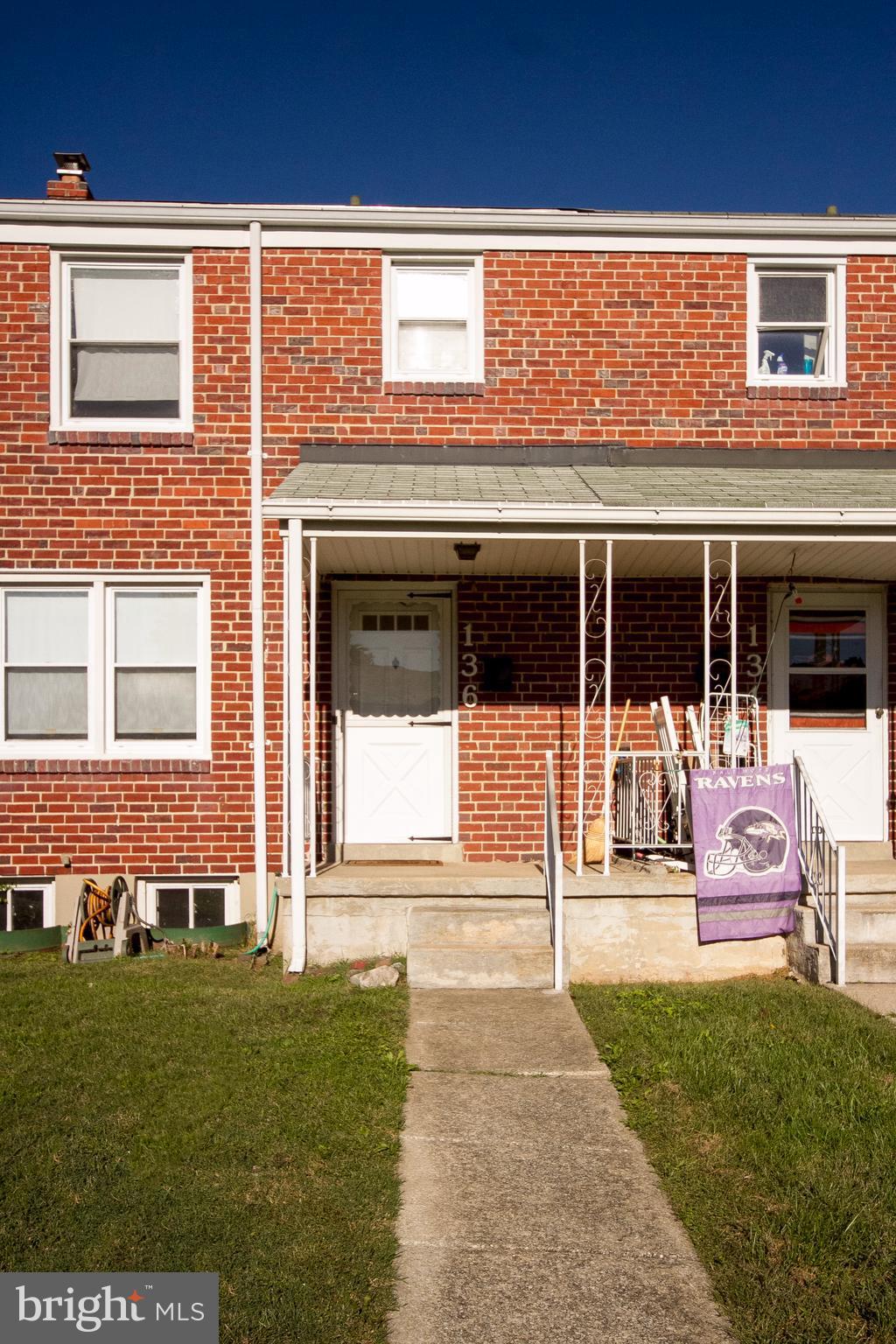 136 Garden Ridge Road Baltimore, MD 21228 - Photo 1 of 25 a front view of a house with a yard