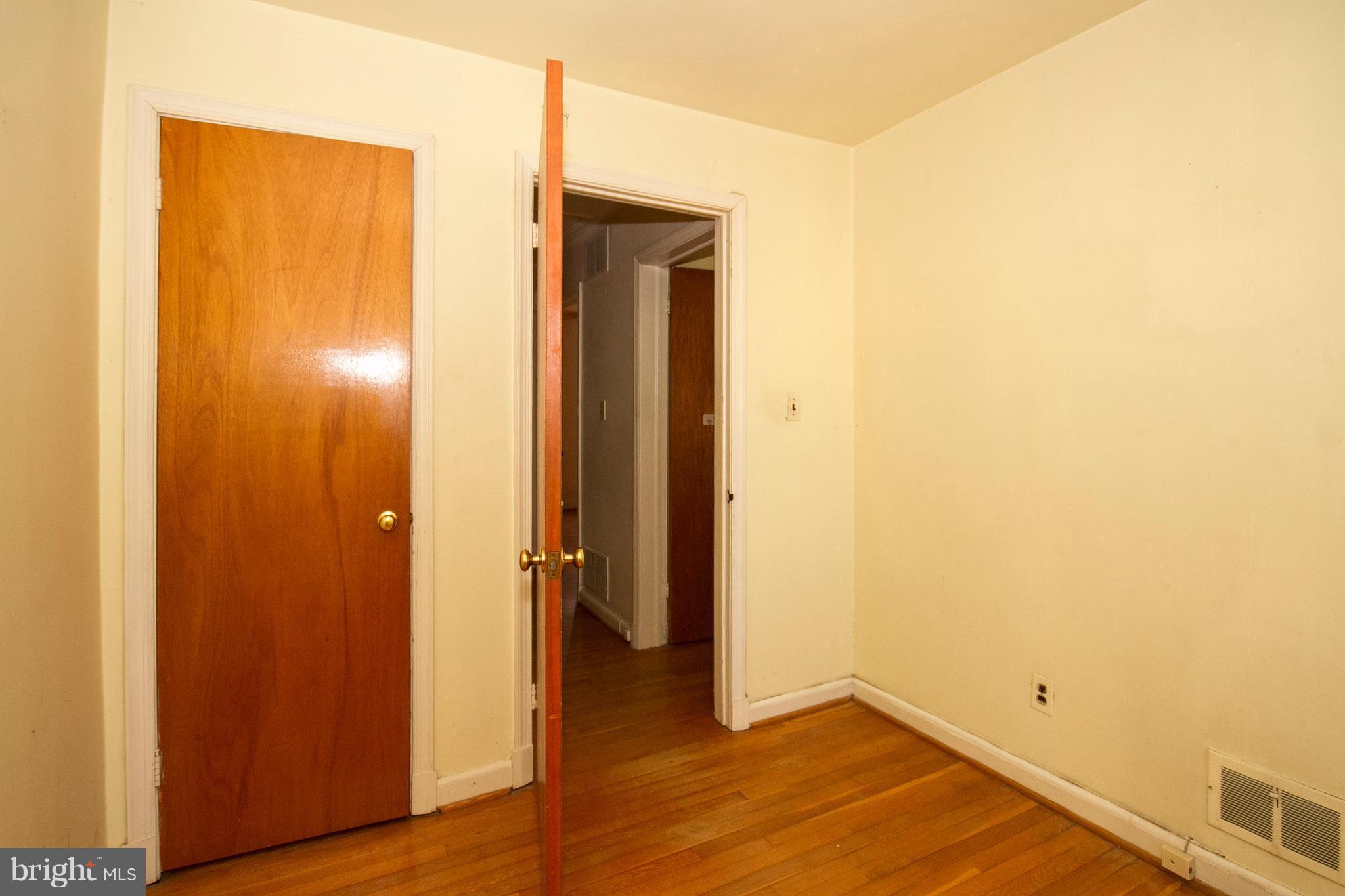 136 Garden Ridge Road Baltimore, MD 21228 - Photo 14 of 25 a view of hallway with wooden floor
