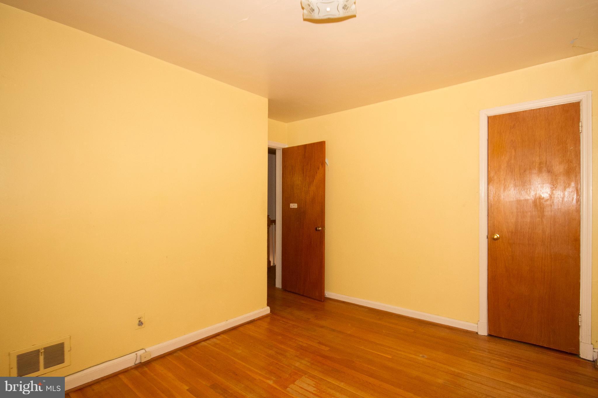 136 Garden Ridge Road Baltimore, MD 21228 - Photo 16 of 25 a view of an empty room with wooden floor