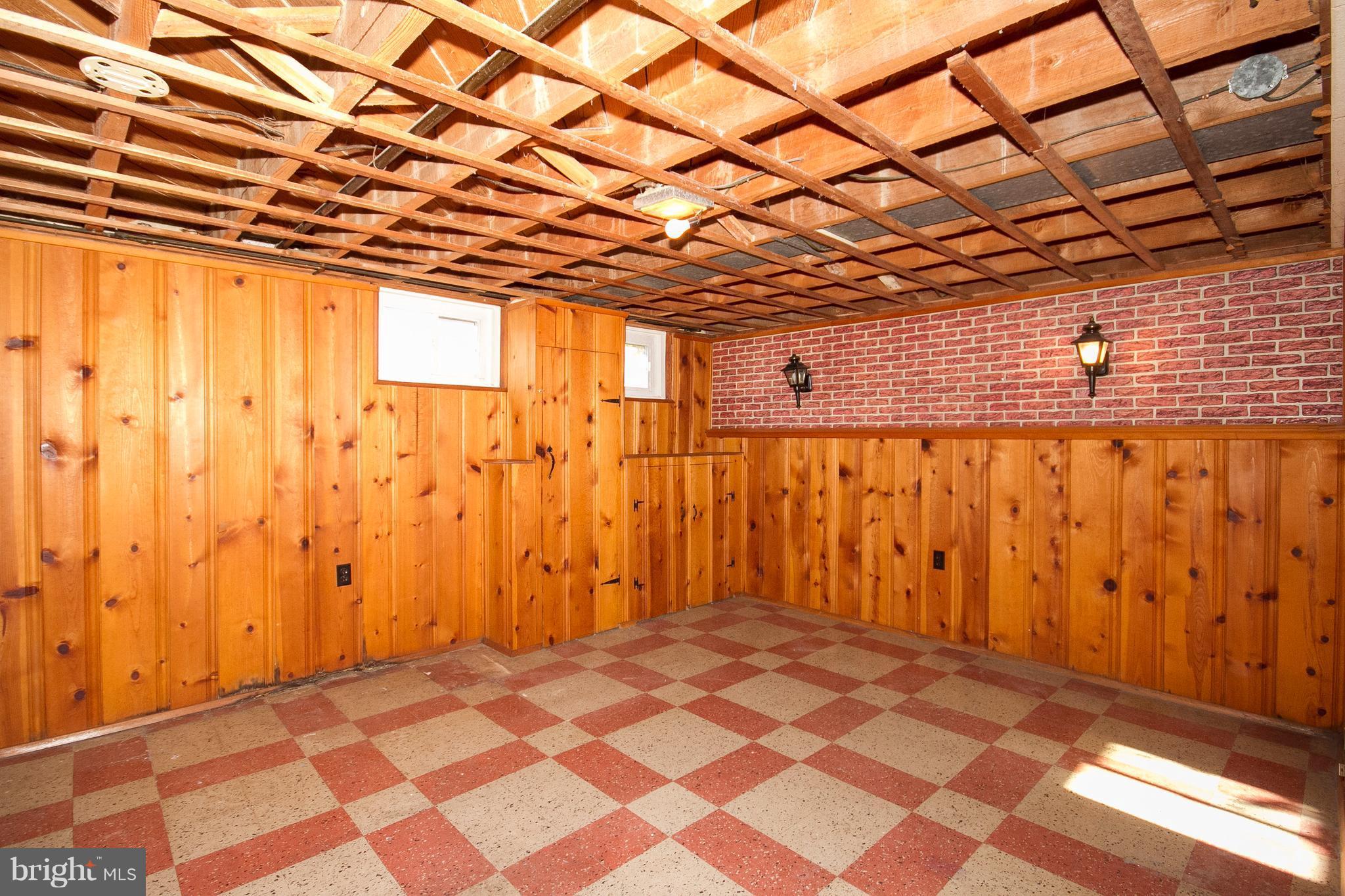 136 Garden Ridge Road Baltimore, MD 21228 - Photo 19 of 25 a view of a room with wooden walls