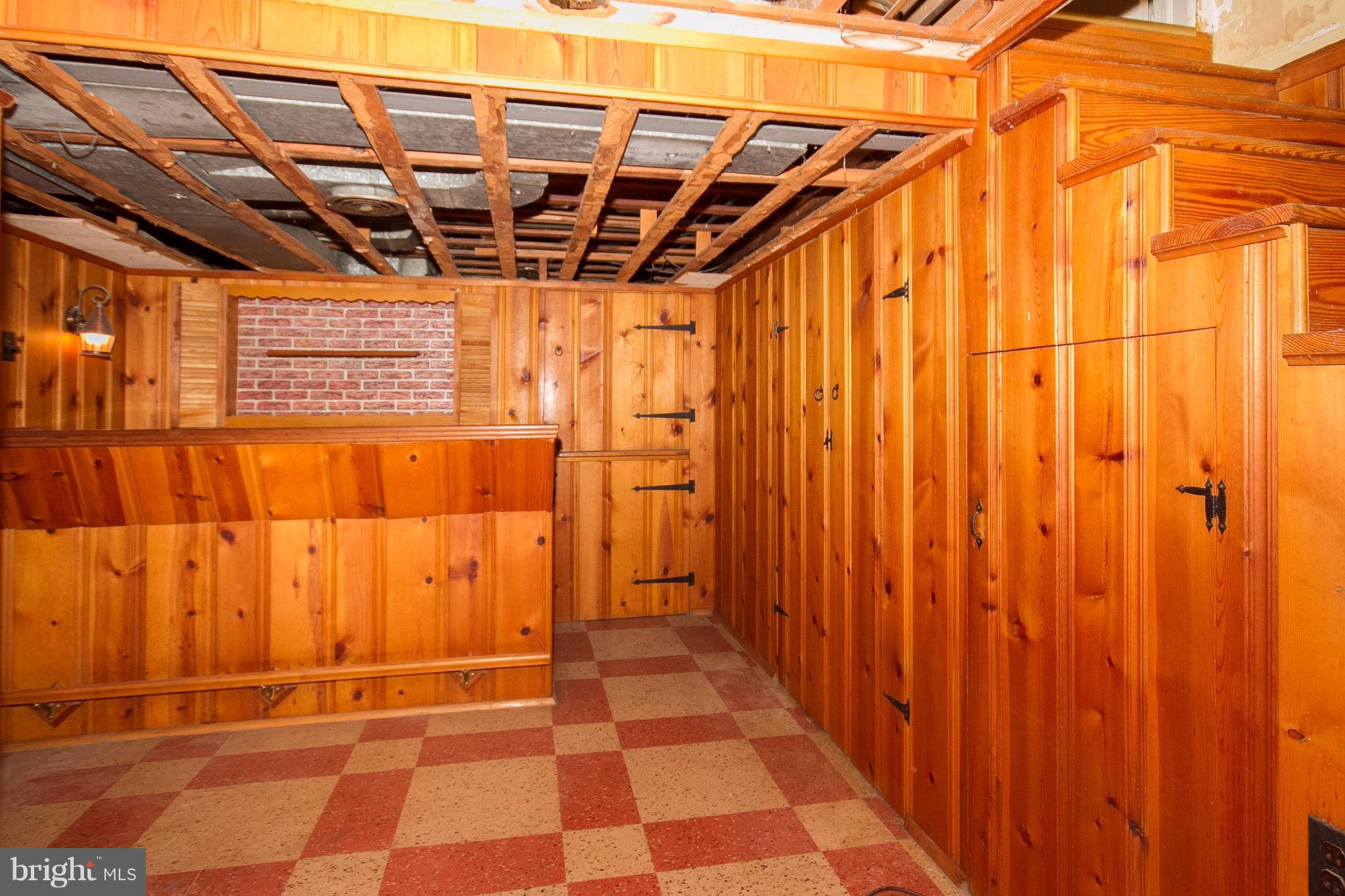 136 Garden Ridge Road Baltimore, MD 21228 - Photo 21 of 25 a view of a garage with a white door and wooden door