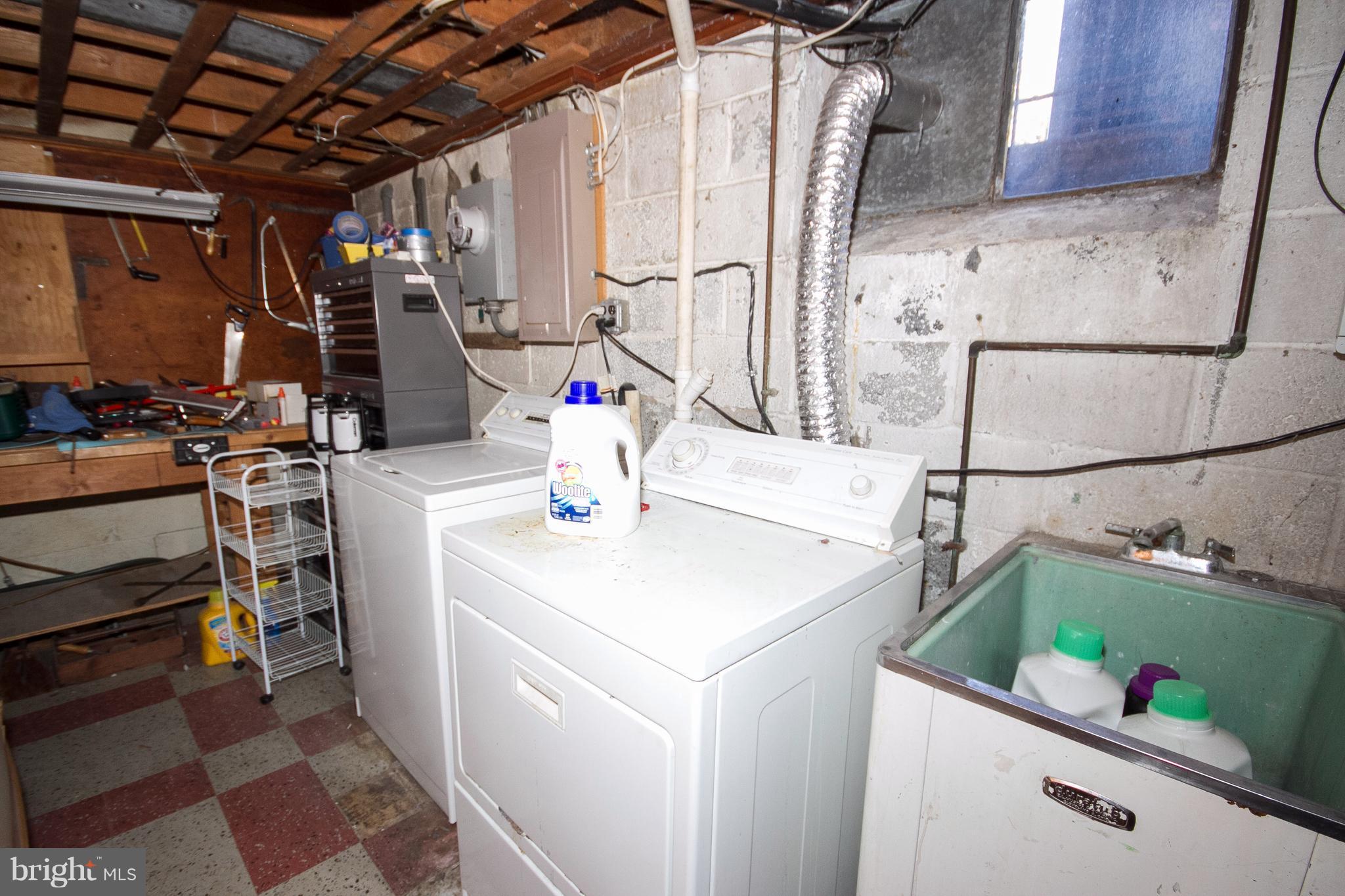 136 Garden Ridge Road Baltimore, MD 21228 - Photo 23 of 25 a utility room with dryer and washer