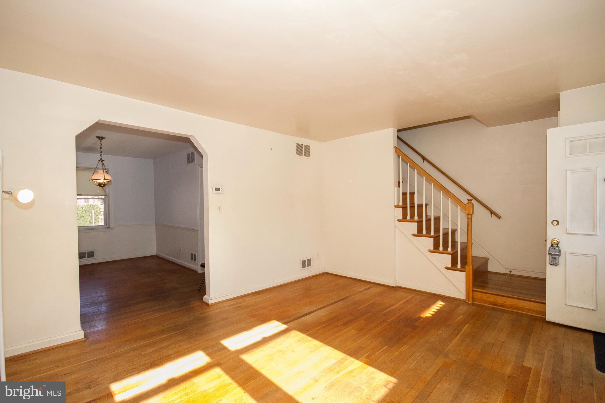 136 Garden Ridge Road Baltimore, MD 21228 - Photo 4 of 25 a view of entryway and hall with wooden floor