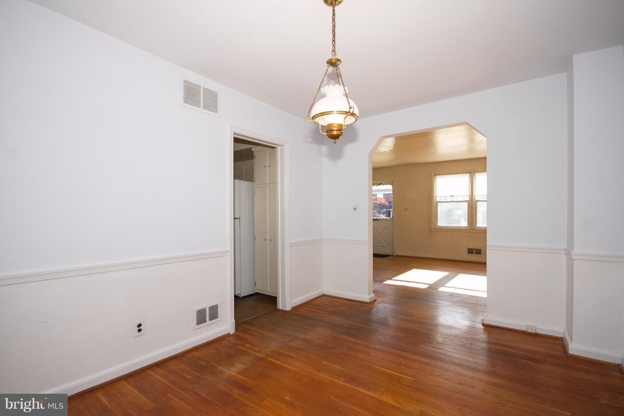 136 Garden Ridge Road Baltimore, MD 21228 - Photo 6 of 25 a view of livingroom with chandelier