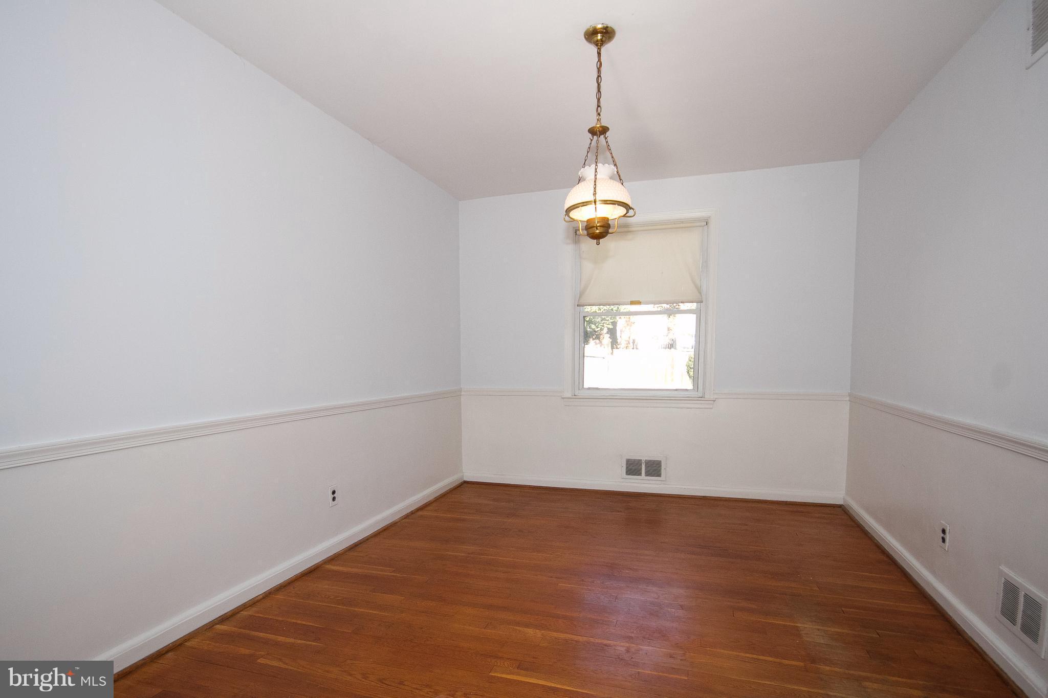 136 Garden Ridge Road Baltimore, MD 21228 - Photo 7 of 25 a view of empty room with window