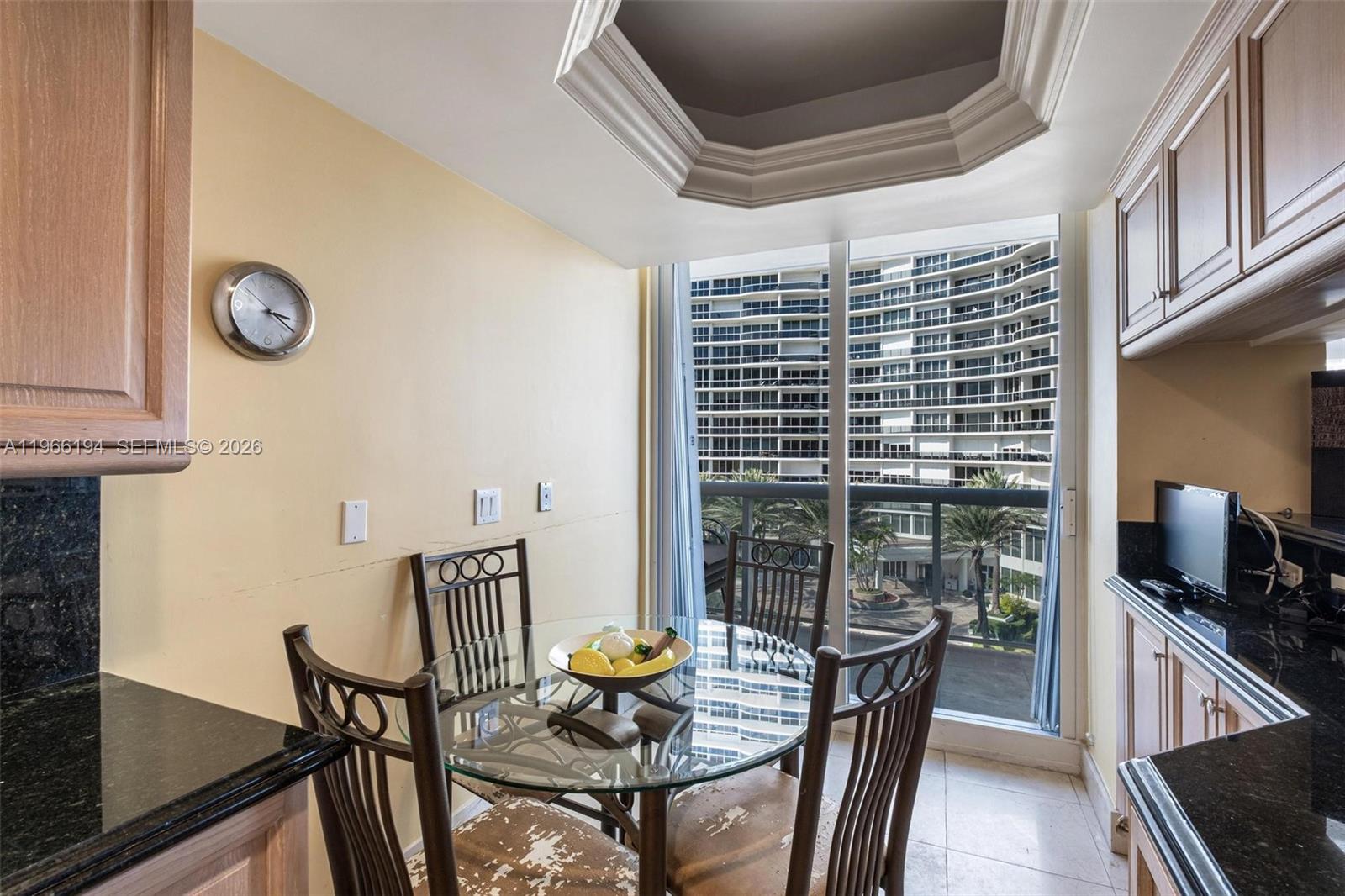 9595 Collins Avenue, Unit N6J Surfside, FL 33154 - Photo 13 of 37 a view of a dining room with furniture window and wooden floor
