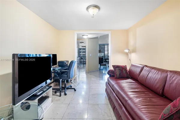 a bedroom with a bed and a tv in it