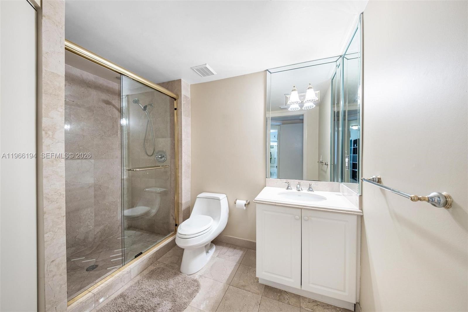 9595 Collins Avenue, Unit N6J Surfside, FL 33154 - Photo 22 of 37 a bathroom with a sink toilet and shower