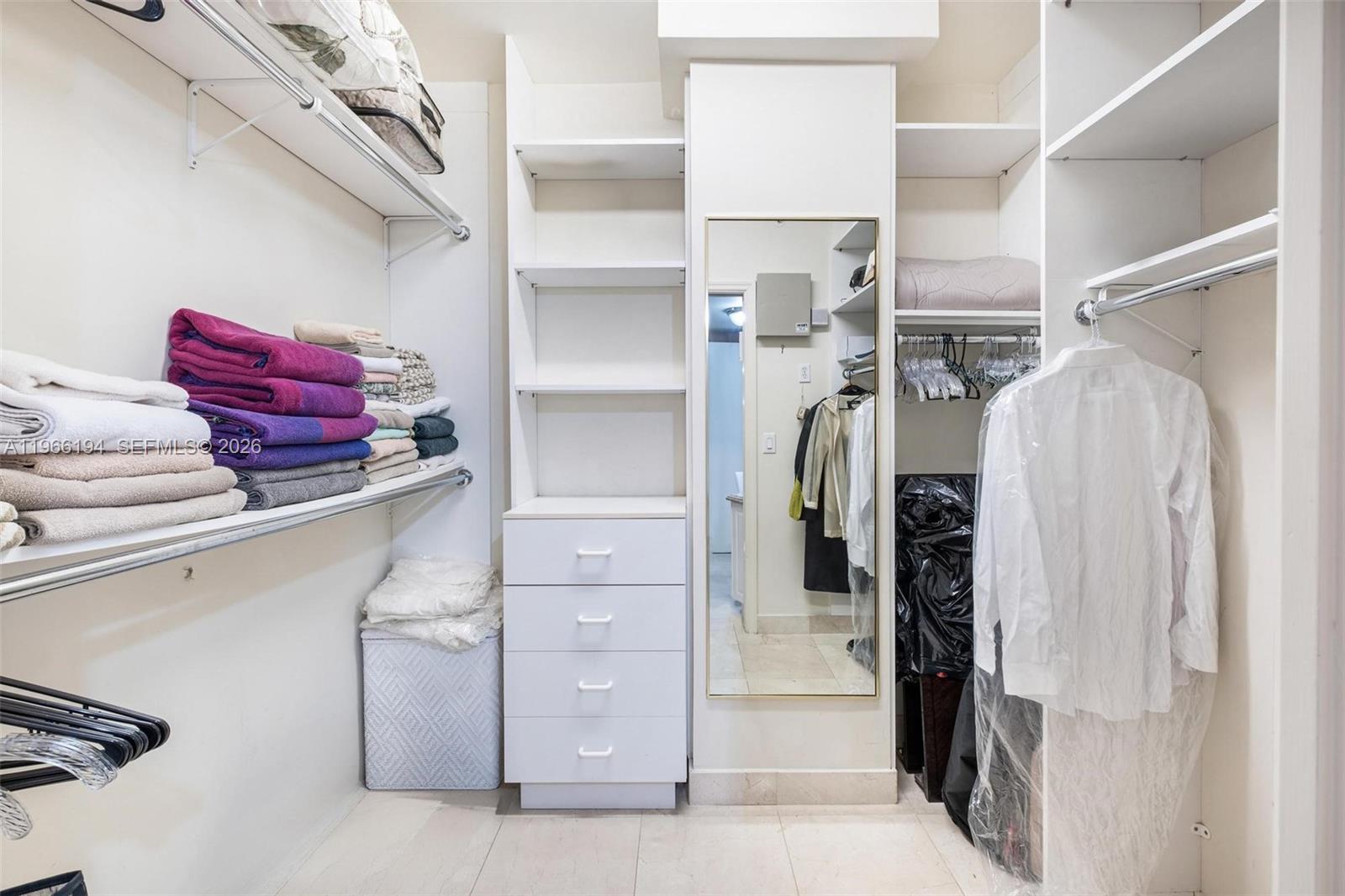9595 Collins Avenue, Unit N6J Surfside, FL 33154 - Photo 26 of 37 a view of walk in closet with clothes and shoes
