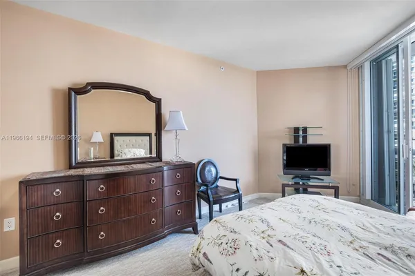 a bedroom with two beds and a couch