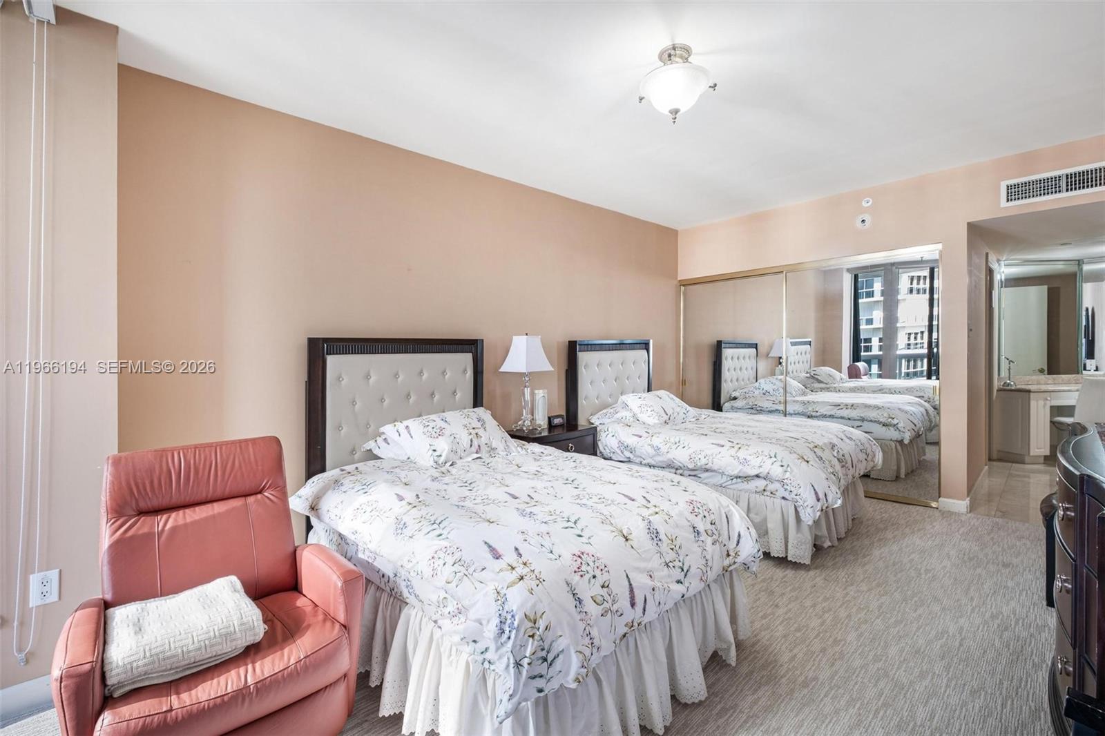 9595 Collins Avenue, Unit N6J Surfside, FL 33154 - Photo 29 of 37 a bedroom with two beds and a couch