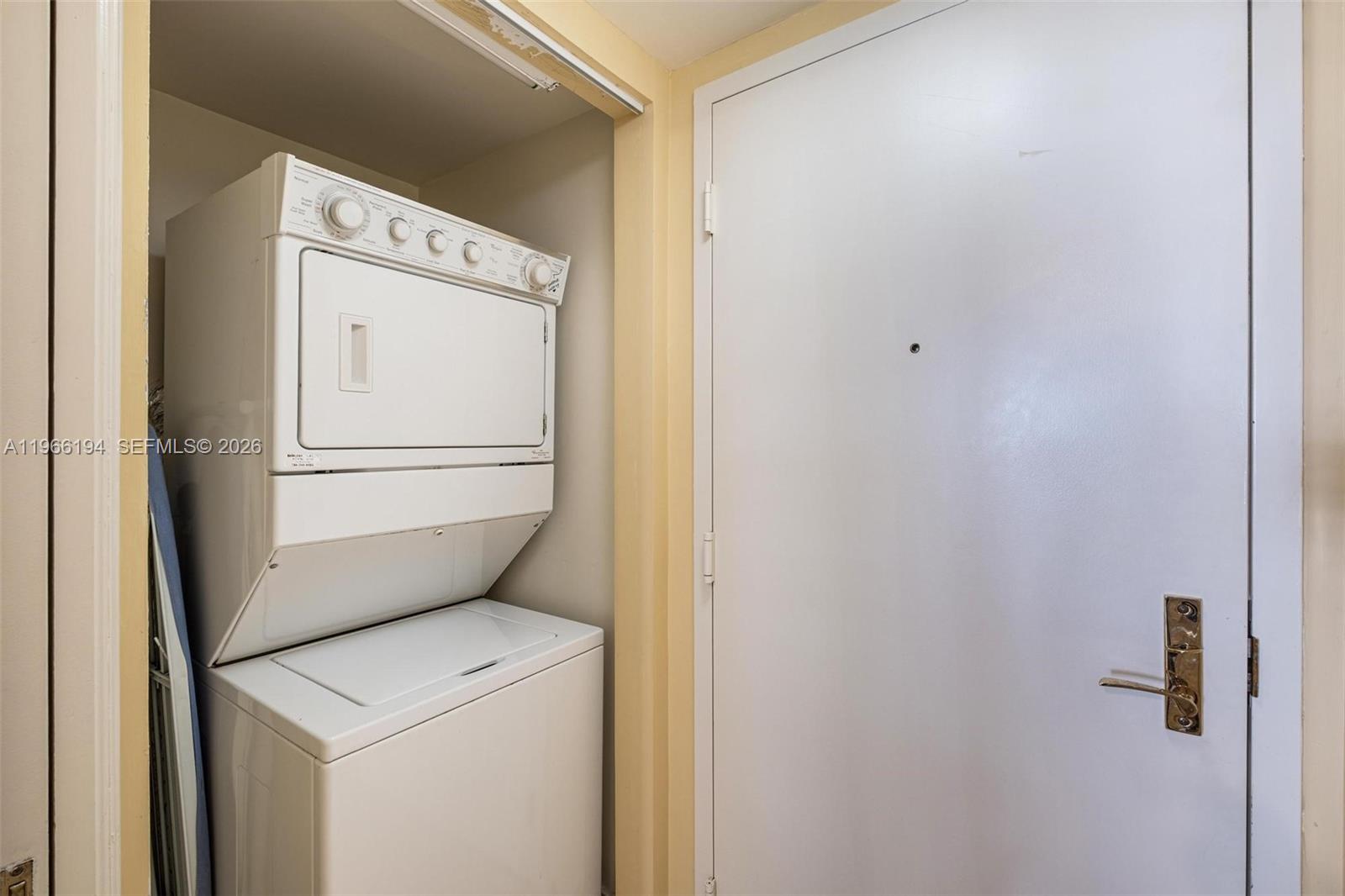 9595 Collins Avenue, Unit N6J Surfside, FL 33154 - Photo 31 of 37 a utility room with dryer and washer