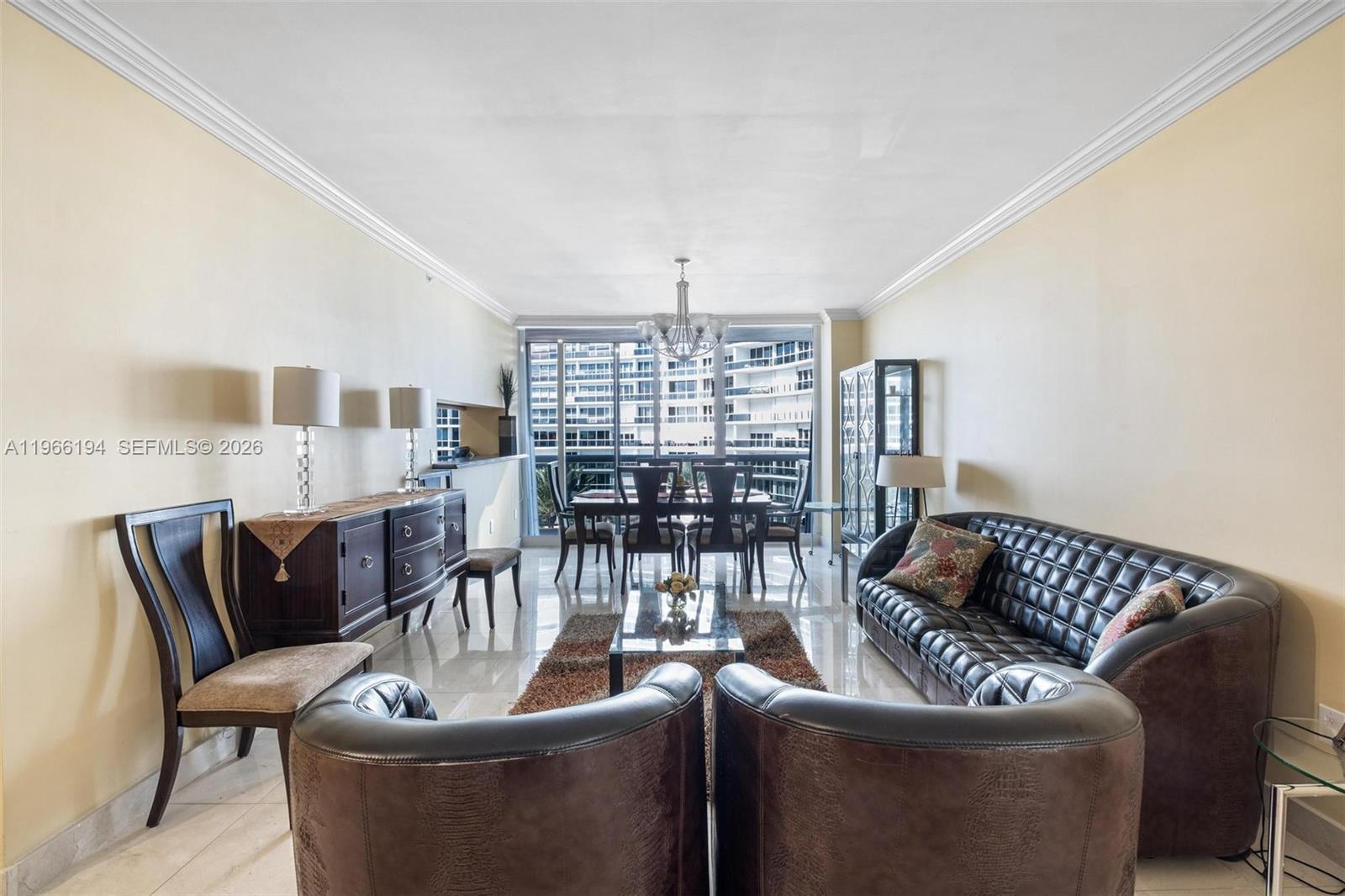 9595 Collins Avenue, Unit N6J Surfside, FL 33154 - Photo 4 of 37 a living room with furniture and a large window
